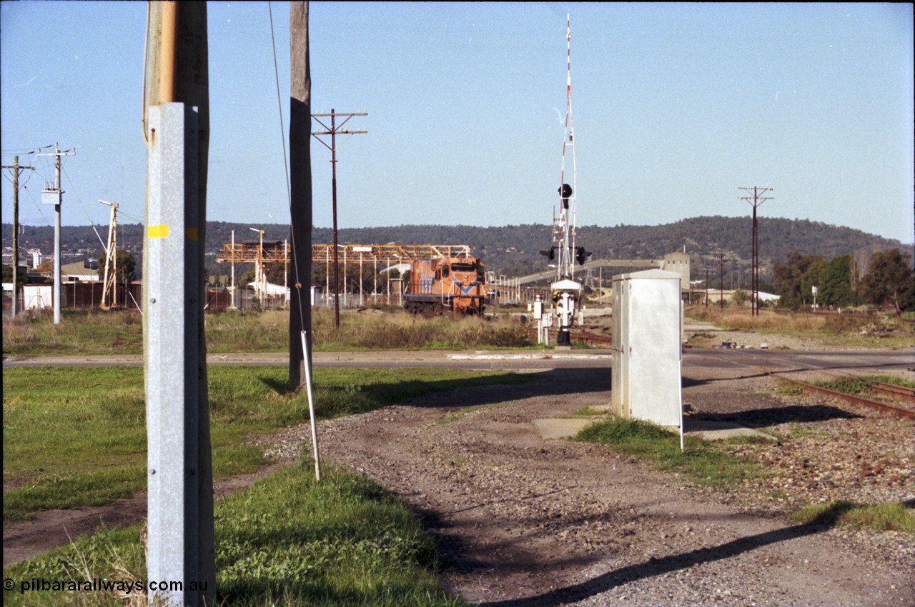 186-22
Bellevue, Westrail standard gauge light engine movement, train 168 stands in the flashbutt sidings prior to departure back to Forrestfield. Locomotive NB class NB 1873 Comeng built ALCo model CE618 serial WA-79 / C6099-3. This unit was originally a WAGR N class on narrow gauge, then reclassed to NA when fitted with air brakes in 1983, and then fitted with ex Mt Newman Mining ALCo M636 bogies in 1994 and classed NB.
Keywords: NB-class;NB1873;Comeng-WA;ALCo;CE618;WA-79/C6099-3;N-class;NA-class;rebuild;