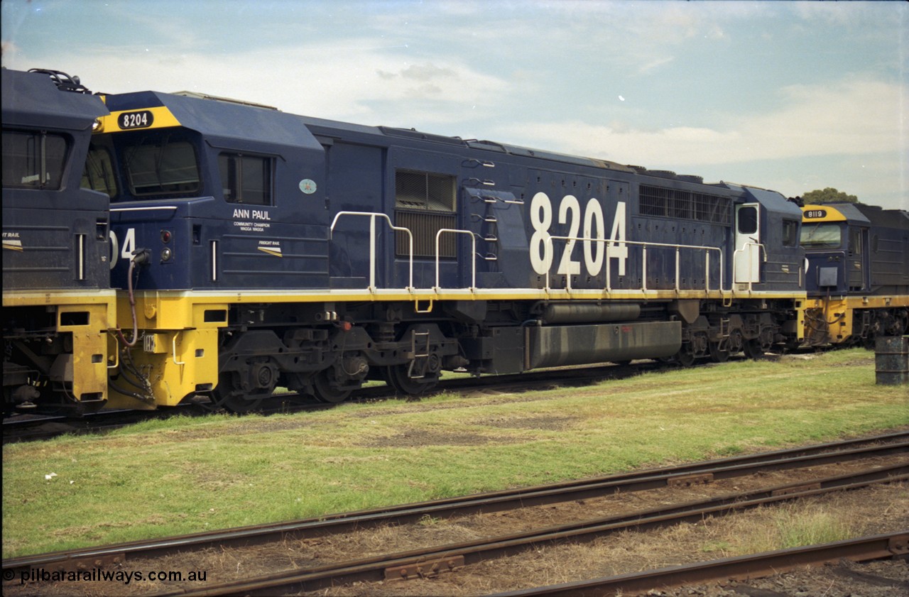 187-25
Yeerongpilly, NSWSRA standard gauge loco depot, 82 class Clyde Engineering built EMD model JT42C unit 8204 'Ann Paul - Wagga Wagga' serial 94-1311. [url=https://goo.gl/maps/MTvf4SEKLkJ2]GeoData[/url].
Keywords: 82-class;8204;Clyde-Engineering-Braemar-NSW;EMD;JT42C;94-1311;