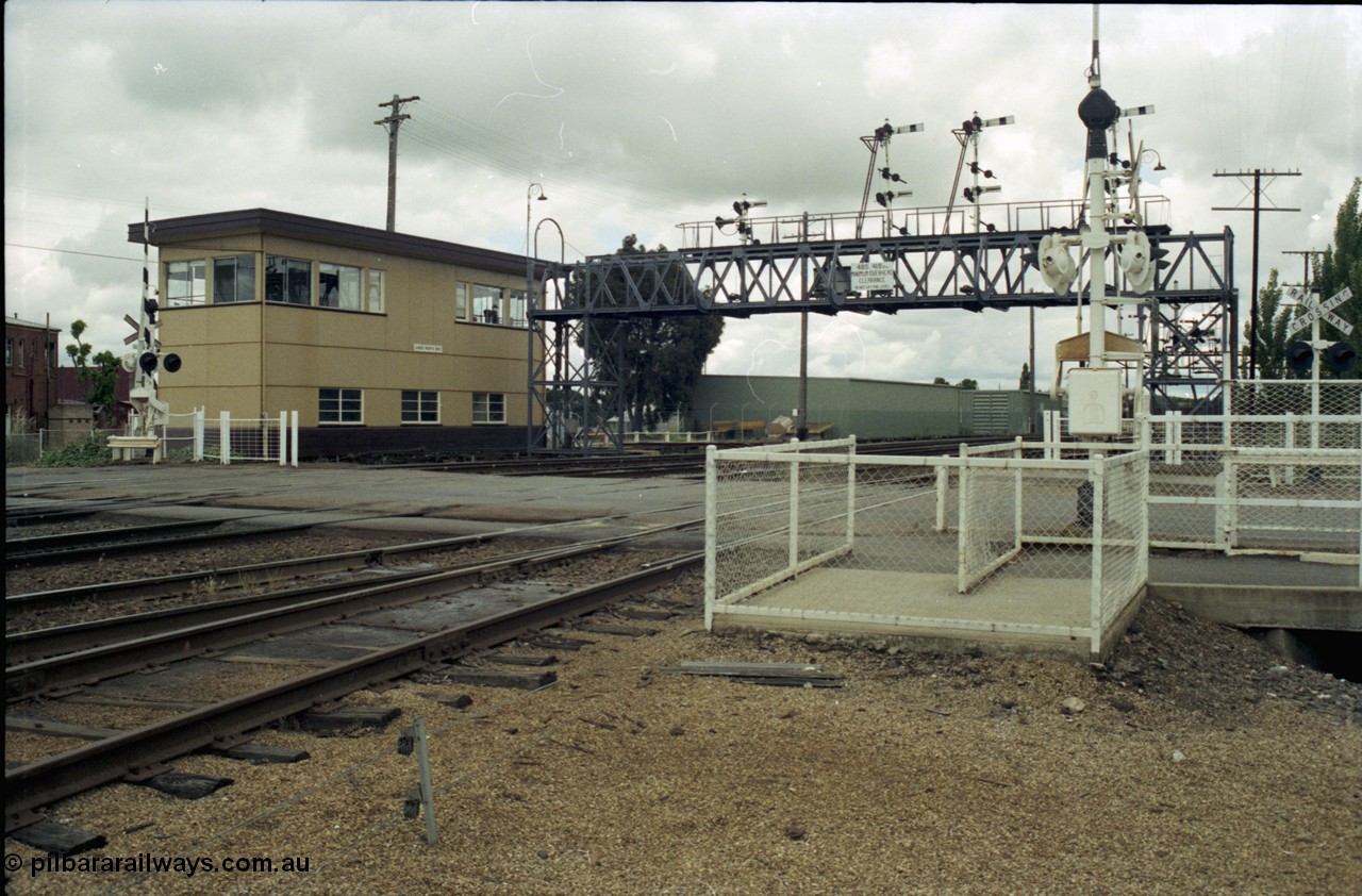 188-26
Junee, NSW Main South, looking north with Junee North Signal Box and the Olympic Hwy grade crossing.
