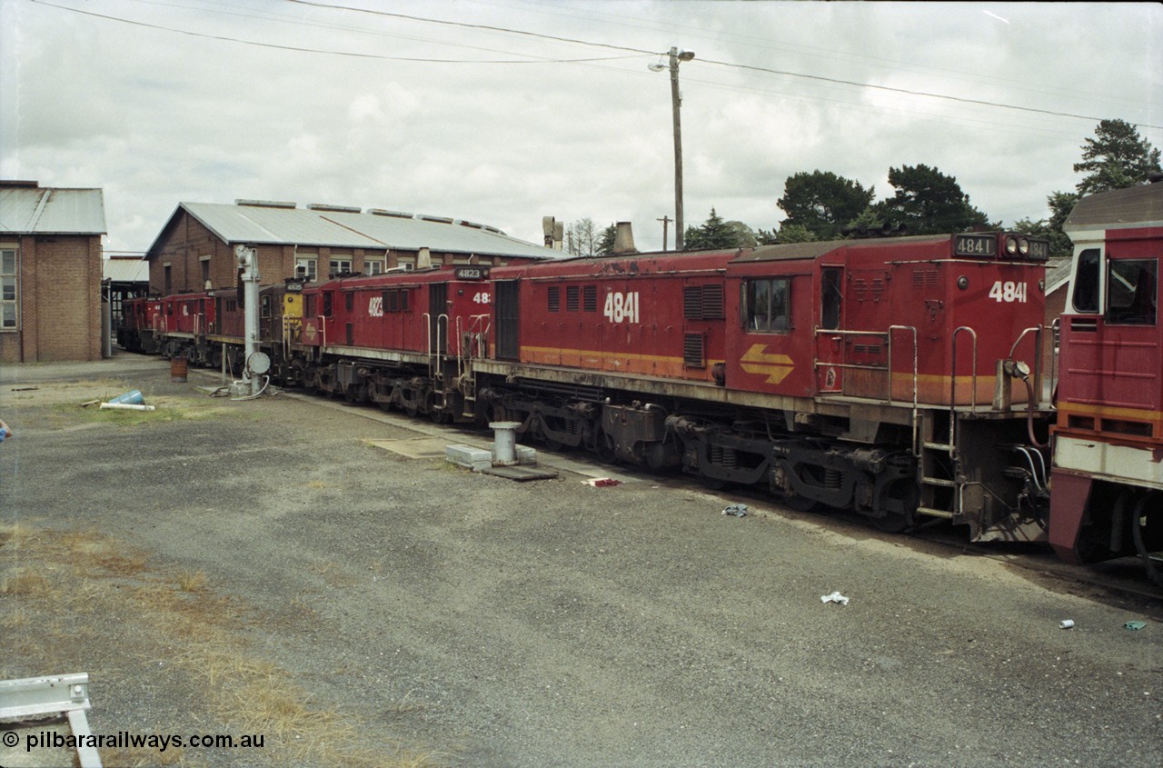 188-33
Junee, NSWSRA standard gauge locomotive depot, 48 class MK I unit 4841 serial 84131 in candy livery, built by AE Goodwin as ALCo model DL531 is joined by three sister units.
Keywords: 48-class;4841;AE-Goodwin;ALCo;DL531;84131;