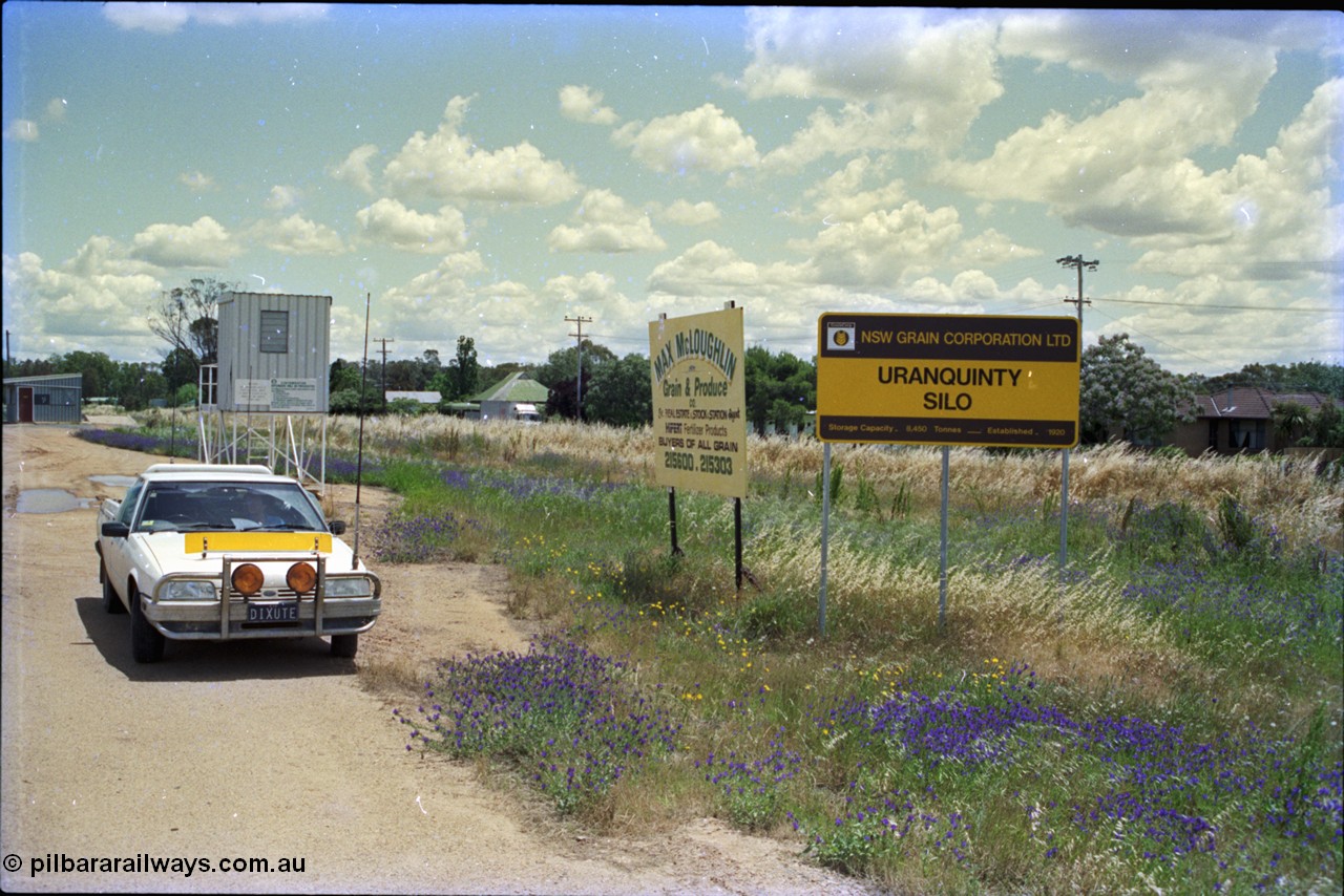 189-03
Uranquinty, sign and building view, the newer weighbridge hut is at the far left, with grain inspection / sampling deck behind the car.
