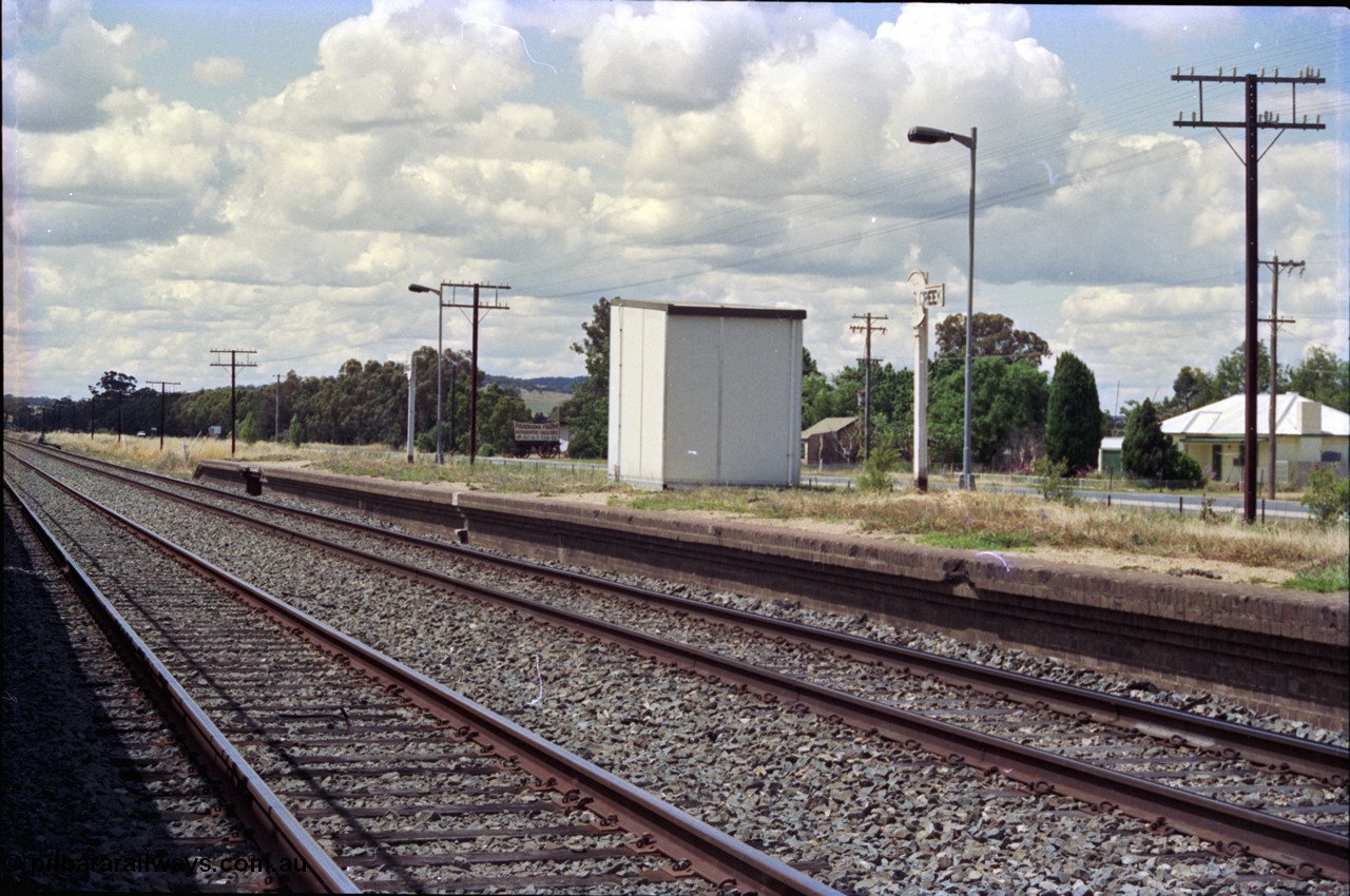 189-18
Yerong Creek, located at the 565.08 km on the NSW Main South line, view looking north at the remains of the station platform, one sign has been snapped in half.
