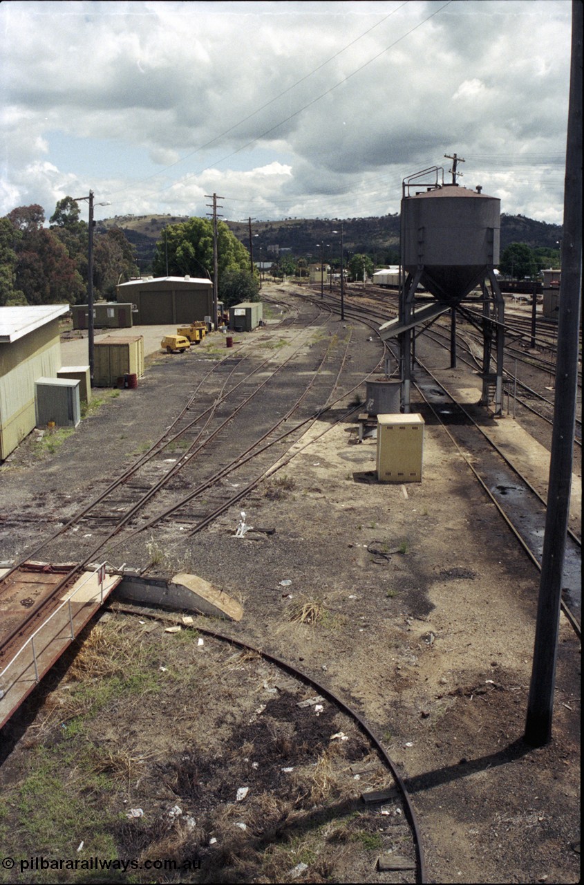 190-01
Cootamundra, NSW Main South, looking south from the pedestrian footbridge, past loco depot, turntable visible with sanding tower.
