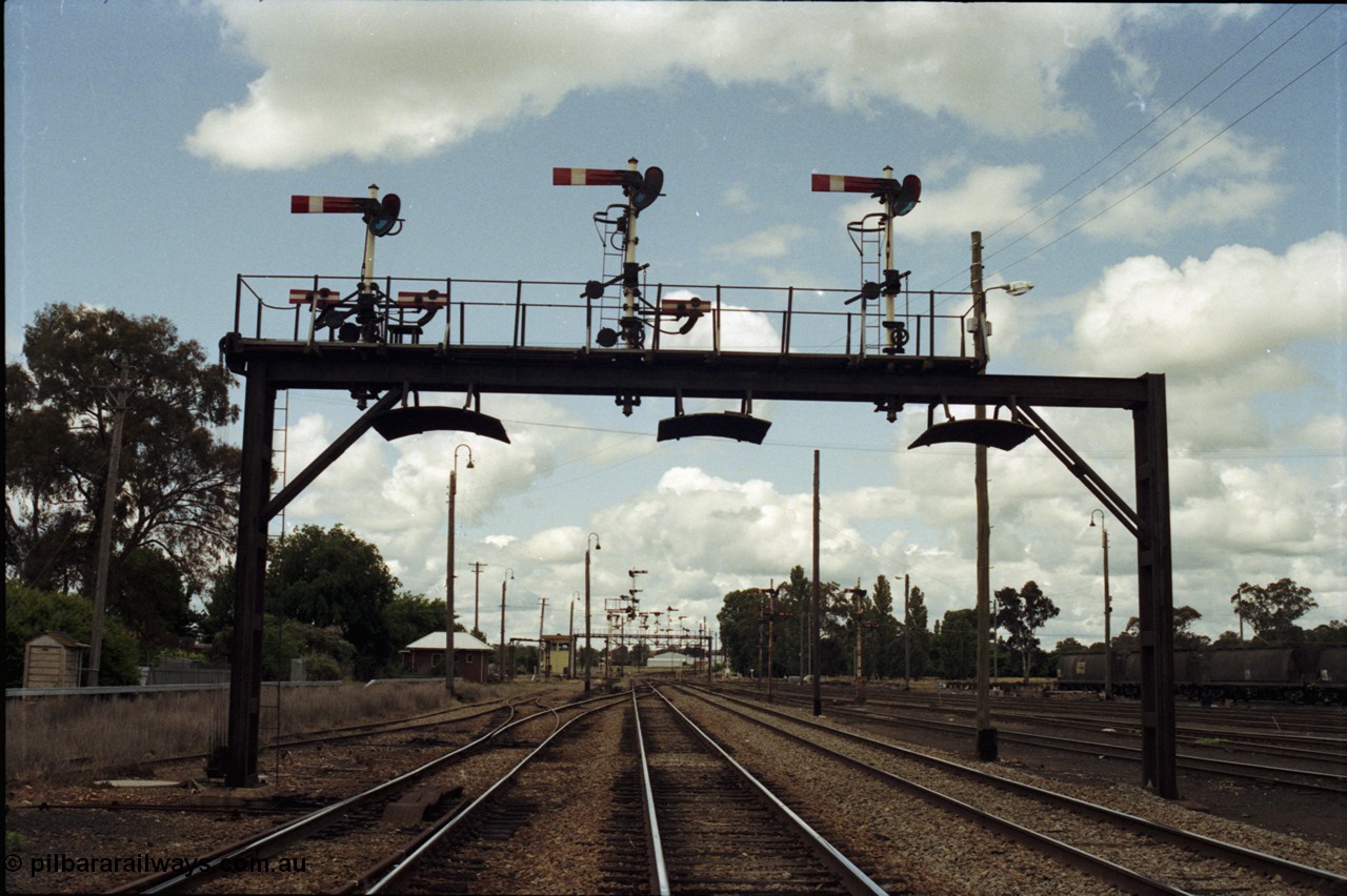 190-07
Cootamundra, NSW Main South, still looking north, another mechanical lower quadrant semaphore signal gantry.
