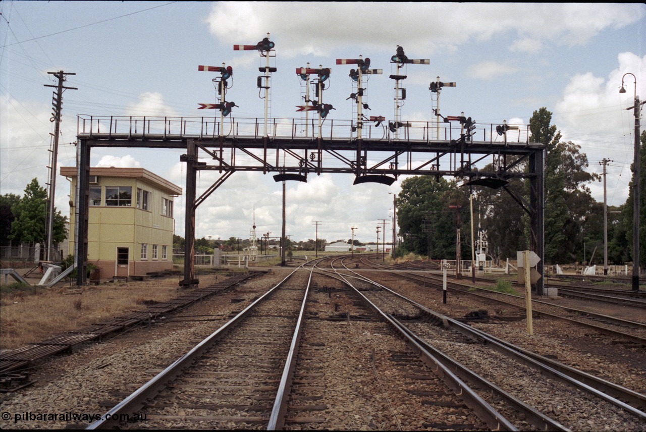 190-09
Cootamundra, NSW Main South, looking north at the 429 km post, North signal box across Pinkerton Rd with the impressive north signal gantry.

