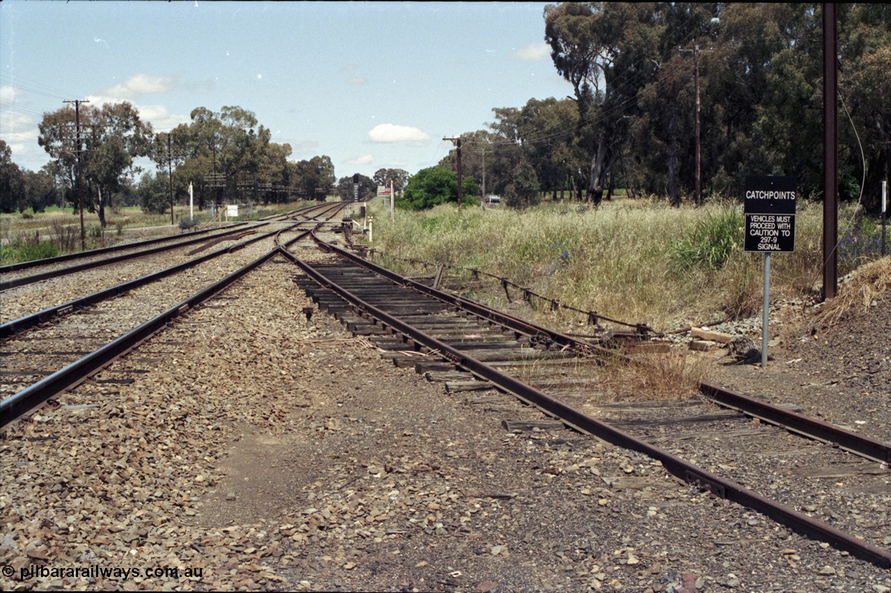 190-31
Marinna, located at the 477.88 km on the NSW Main South line, view looking south with grain siding catch points at right, passive grade crossing and mainline crossover in the distance.
