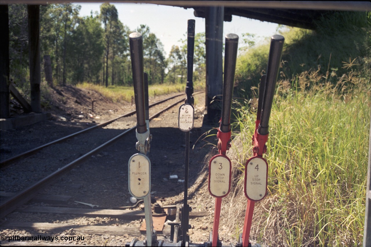 193-10
Moodlu Quarry junction ground frame signal levers. Looking east in the Up direction under the overbridge.
