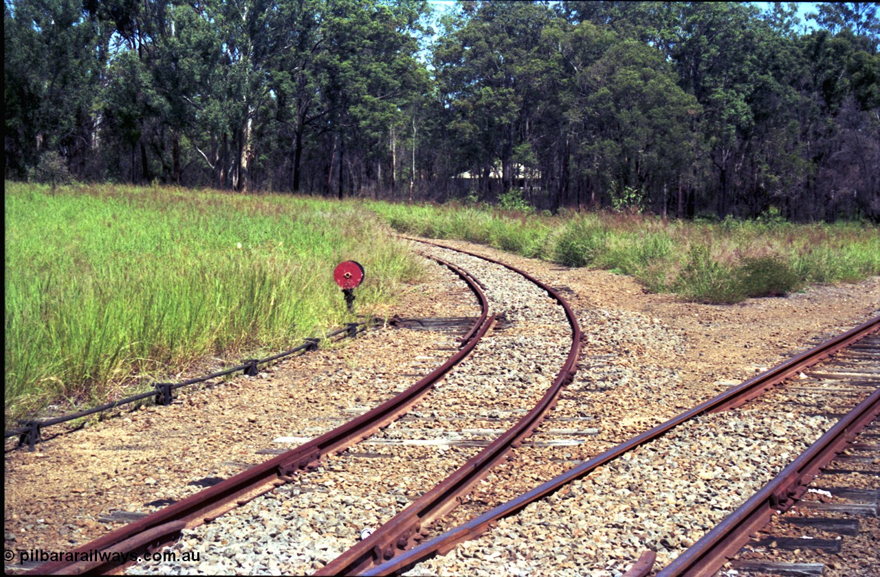 193-12
Moodlu Quarry line curving around to the left with catch point and disc, the line on the right is curving towards Moodlu station site.

