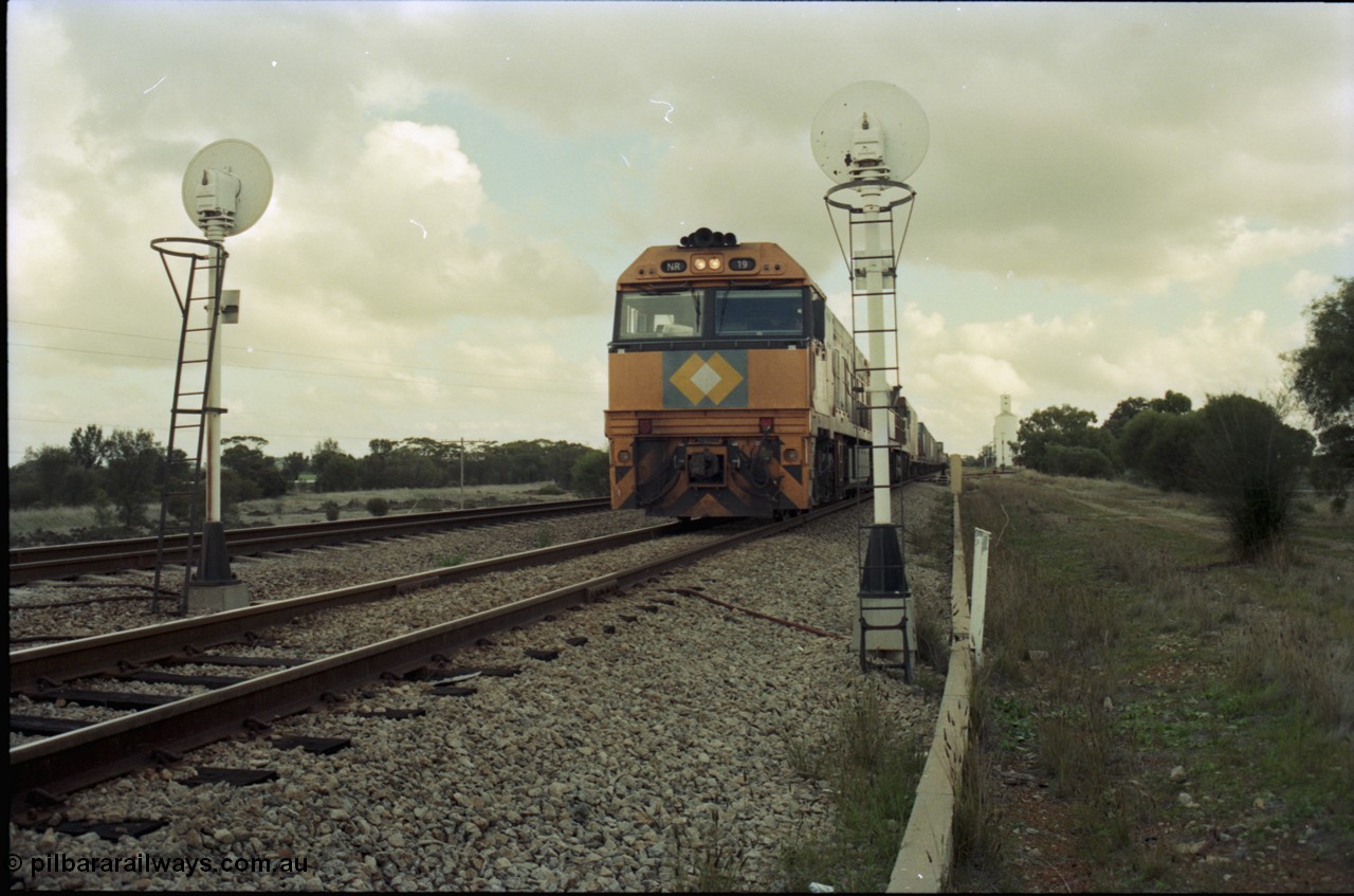 199-11
Meckering, National Rail NR class units NR 19 and NR 20 both being Goninan built GE Cv40-9i models head up train 7PM5 as they wait for a cross with the Prospector in the loop 1400 hrs 21st June 1997.
Keywords: NR-class;NR19;Goninan;GE;CV40-9i;7250-03/97-221;
