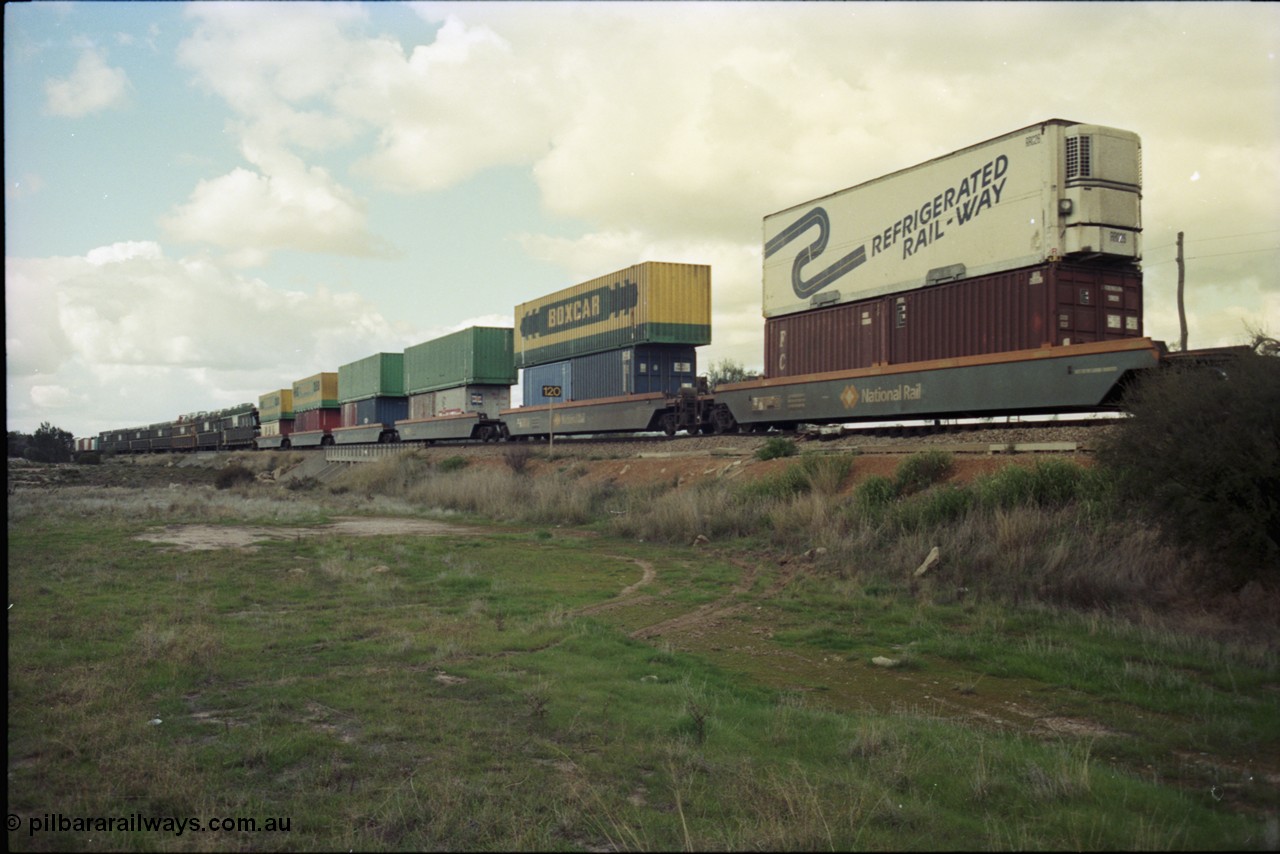199-22
Meckering, train 7PM5 double stacked east bound with BOX CAR and Refrigerated Rail-Way containers and reefers, 21st June 1997.
