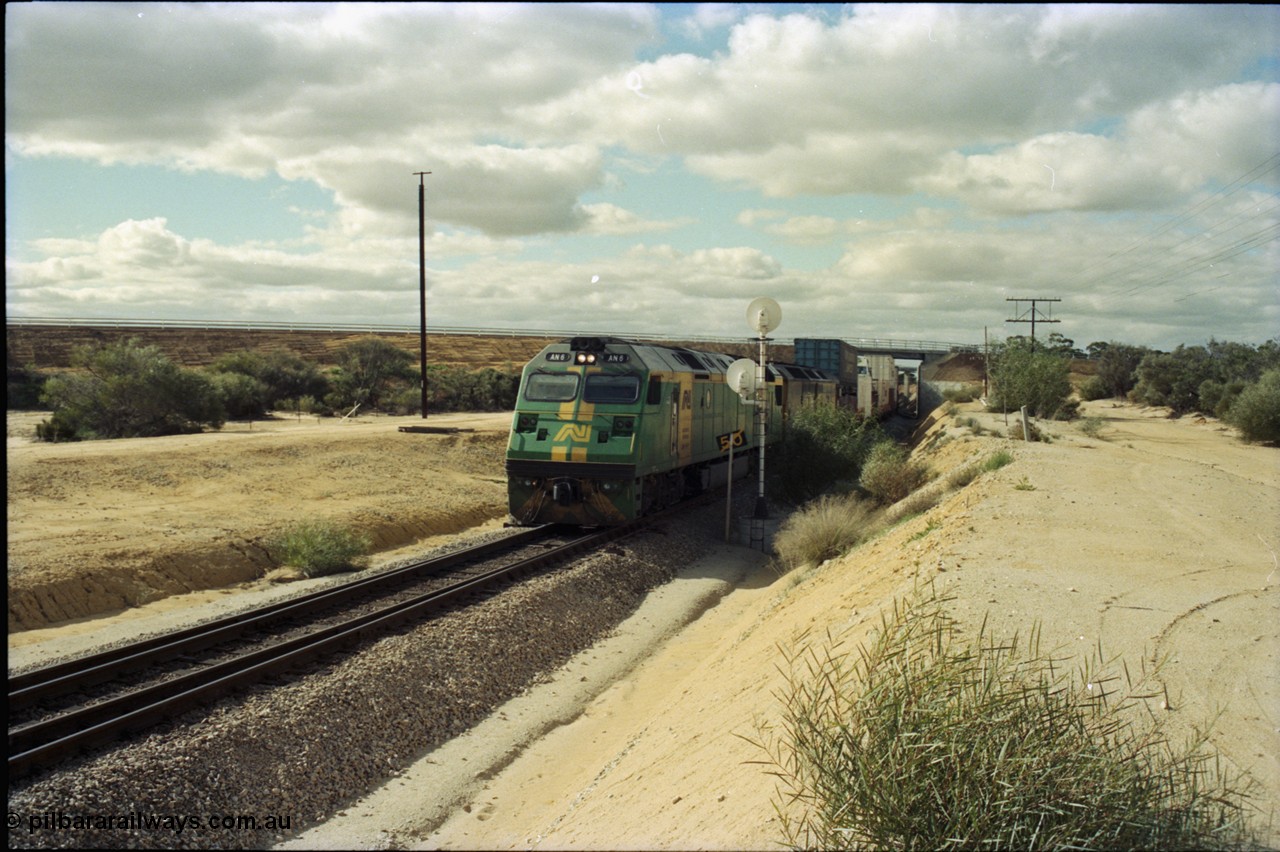 199-25
Moorine Rock, Australian National AN class unit AN 6 a Clyde Engineering EMD model JT46C serial 93-1302 built in Somerton Victoria and rebuild ALF class ALF 24 arrive on the mainline with a Perth bound freight 22nd June 1997.
Keywords: AN-class;AN6;Clyde-Engineering-Somerton-Victoria;EMD;JT46C;93-1302;