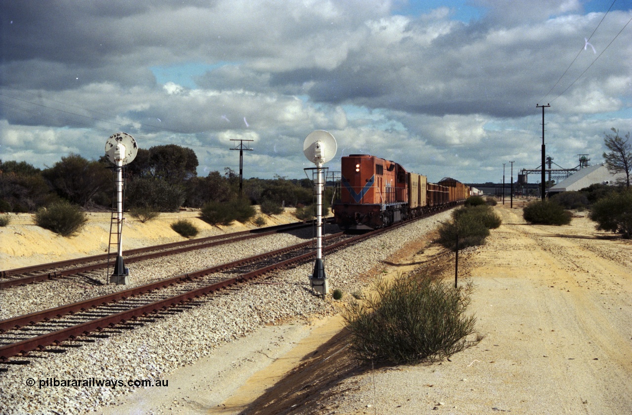 200-01
Moorine Rock, Westrail L class 271 Clyde Engineering EMD model GT26C serial 69-620 runs through the loop with the ballast cleaning train, known as the Circus Train while a Perth bound freighter sits in the mainline, 22nd June 1997.
Keywords: L-class;L271;Clyde-Engineering-Granville-NSW;EMD;GT26C;69-620;