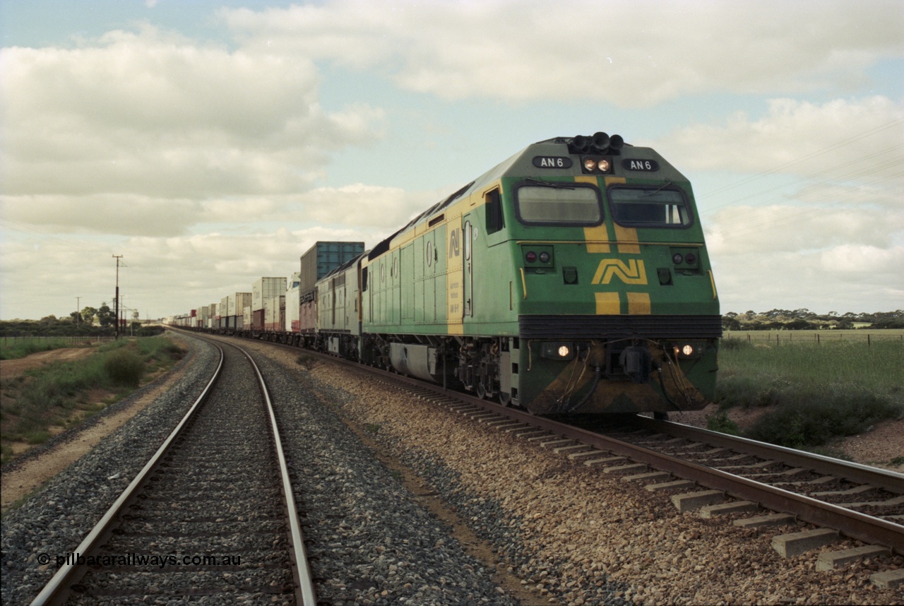 200-09
Moorine Rock, Australian National AN class AN 6 a Clyde Engineering built EMD model JT46C serial 93-1302, sits on the mainline with a Perth bound freight, 1500 hrs 22nd June 1997.
Keywords: AN-class;AN6;Clyde-Engineering-Somerton-Victoria;EMD;JT46C;93-1302;