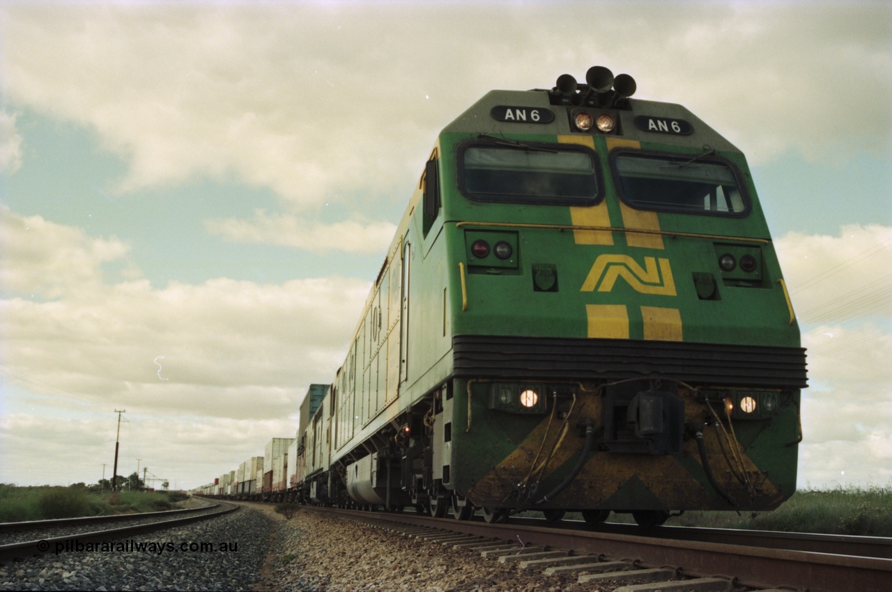200-16
Moorine Rock, Australian National AN class AN 6 a Clyde Engineering built EMD model JT46C serial 93-1302, sits on the mainline with a Perth bound freight, 22nd June 1997.
Keywords: AN-class;AN6;Clyde-Engineering-Somerton-Victoria;EMD;JT46C;93-1302;