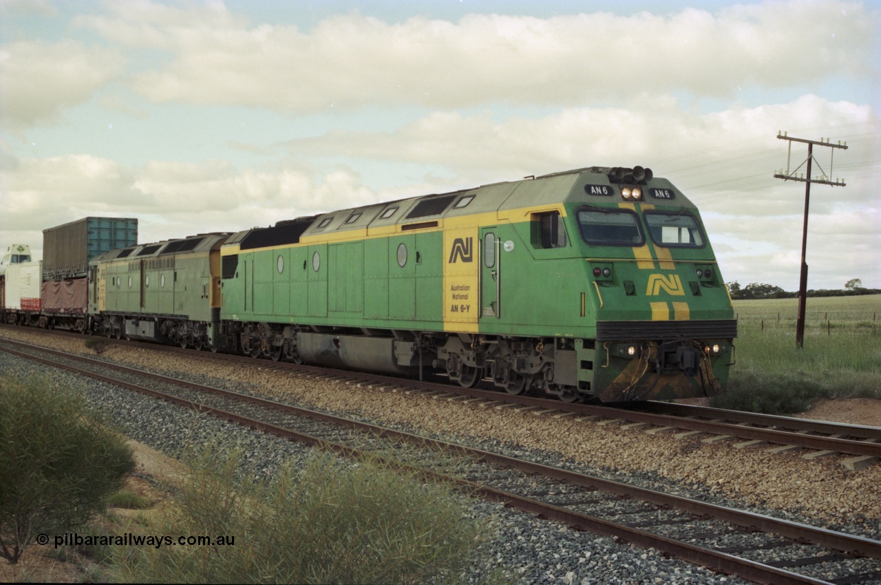 200-17
Moorine Rock, Australian National AN class AN 6 a Clyde Engineering built EMD model JT46C serial 93-1302 and ALF class 24 on the mainline with a Perth bound freight, 22nd June 1997.
Keywords: AN-class;AN6;Clyde-Engineering-Somerton-Victoria;EMD;JT46C;93-1302;