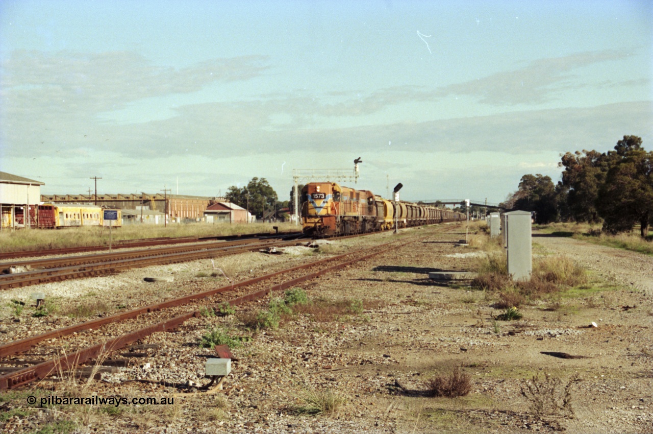 200-19
Midland, Westrail's Clyde Engineering built EMD model G26C as the DA class, DA 1573 serial 72-760 and DA 1574 serial 72-761 lead an empty grain train to Avon past the Midland Workshops at 0925 hrs 24th June 1997.
Keywords: DA-class;DA1573;Clyde-Engineering-Granville-NSW;EMD;G26C;72-760;