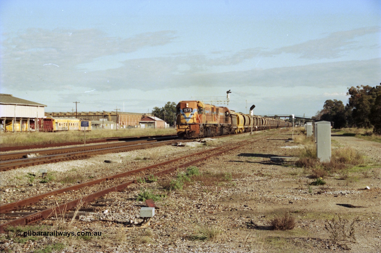 200-20
Midland, Westrail's Clyde Engineering built EMD model G26C as the DA class, DA 1573 serial 72-760 and DA 1574 serial 72-761 lead an empty grain train to Avon past the Midland Workshops at 0925 hrs 24th June 1997.
Keywords: DA-class;DA1573;Clyde-Engineering-Granville-NSW;EMD;G26C;72-760;