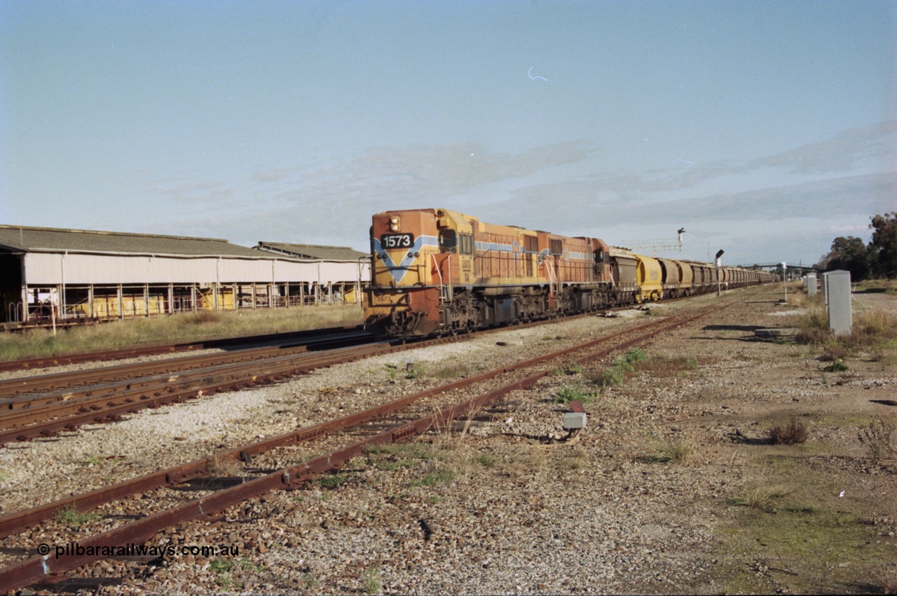 200-21
Midland, Westrail's Clyde Engineering built EMD model G26C as the DA class, DA 1573 serial 72-760 and DA 1574 serial 72-761 lead an empty grain train to Avon past the Midland Workshops at 0925 hrs 24th June 1997.
Keywords: DA-class;DA1573;Clyde-Engineering-Granville-NSW;EMD;G26C;72-760;