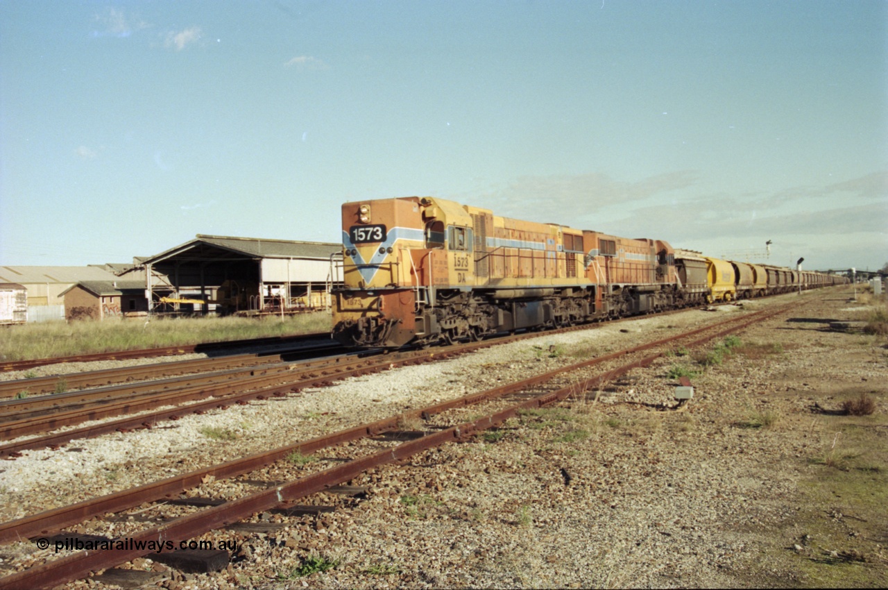 200-22
Midland, Westrail's Clyde Engineering built EMD model G26C as the DA class, DA 1573 serial 72-760 and DA 1574 serial 72-761 lead an empty grain train to Avon past the Midland Workshops at 0925 hrs 24th June 1997.
Keywords: DA-class;DA1573;Clyde-Engineering-Granville-NSW;EMD;G26C;72-760;
