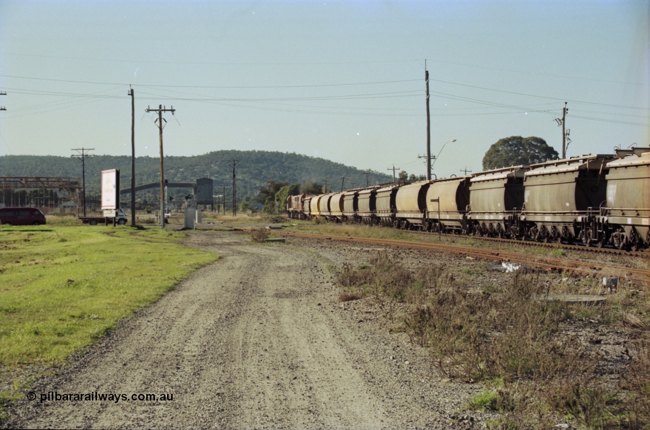 200-25
Midland, Westrail's Clyde Engineering built EMD model G26C as the DA class, DA 1573 serial 72-760 and DA 1574 serial 72-761 lead an empty grain train to Avon across the Lloyd Street grade crossing, 0925 hrs 24th June 1997.
Keywords: DA-class;DA1573;Clyde-Engineering-Granville-NSW;EMD;G26C;72-760;