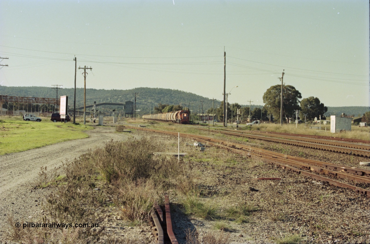200-30
Midland, loaded standard gauge grain train behind Westrail L class L 264 Clyde Engineering built EMD model GT26C serial 68-554 about to cross Lloyd Street grade crossing 0940 hrs 24th June 1997.
Keywords: L-class;L264;Clyde-Engineering-Granville-NSW;EMD;GT26C;68-554;
