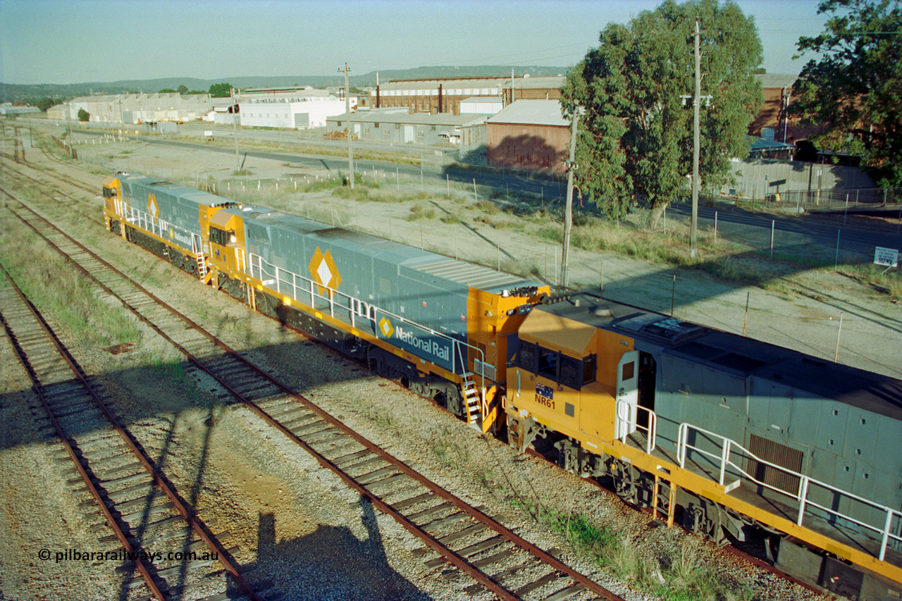 201-15
Midland, two brand Goninan WA built GE Cv40-9i model NR class units NR 101 serial 7250-07/97-303 and NR 102 serial 7250-07/97-302 with the original Perth built NR 61 serial 7250-11/96-263 as the shunt around the yard.
Keywords: NR-class;NR101;Goninan;GE;CV40-9i;7250-07/97-303;