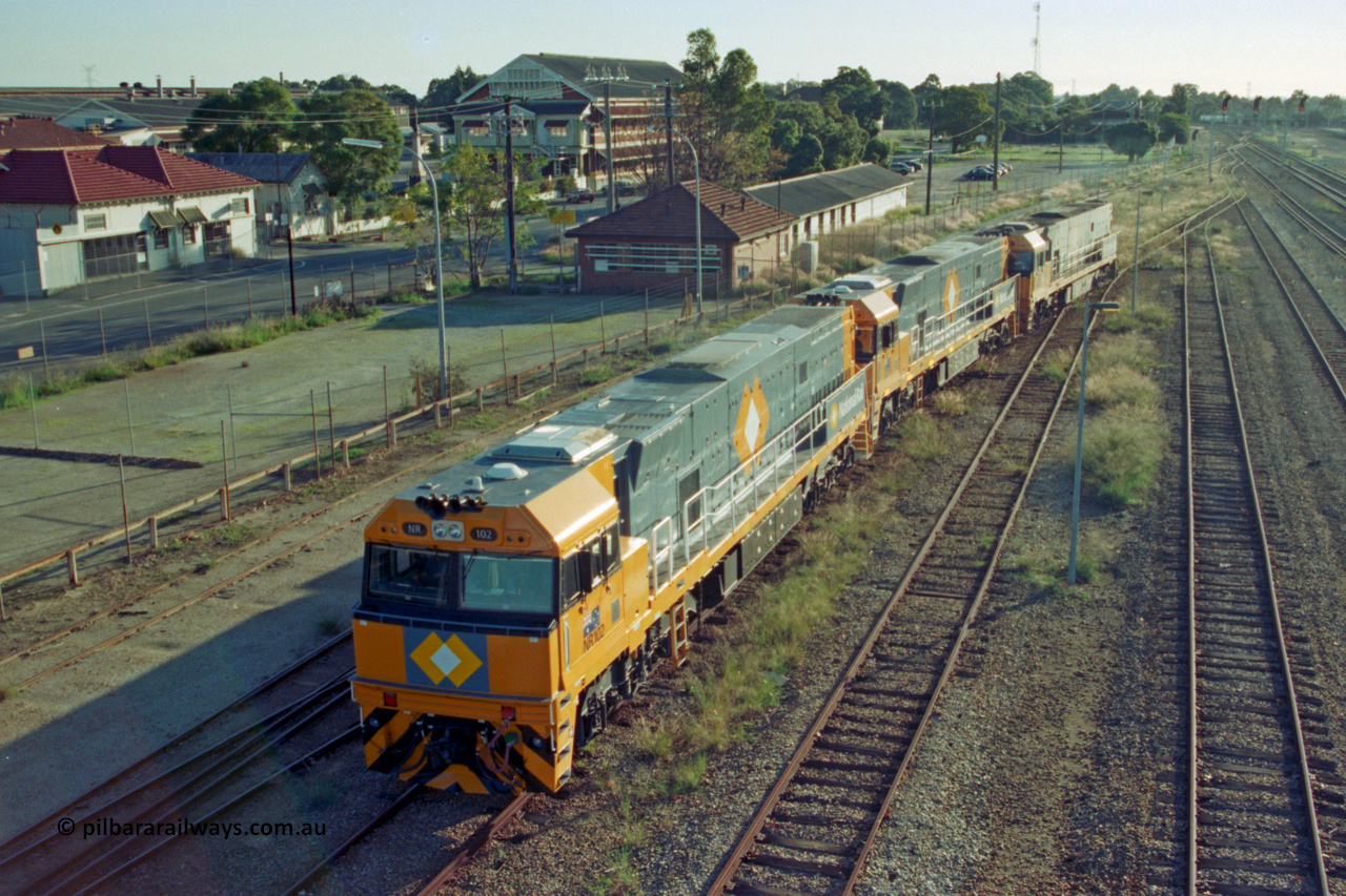 201-16
Midland, two brand Goninan WA built GE Cv40-9i model NR class units NR 102 serial 7250-07/97-302 and NR 101 serial 7250-07/97-303 lead the original Perth built NR 61 serial 7250-11/96-263 as the shunt around the yard.
Keywords: NR-class;NR102;Goninan;GE;CV40-9i;7250-07/97-302;