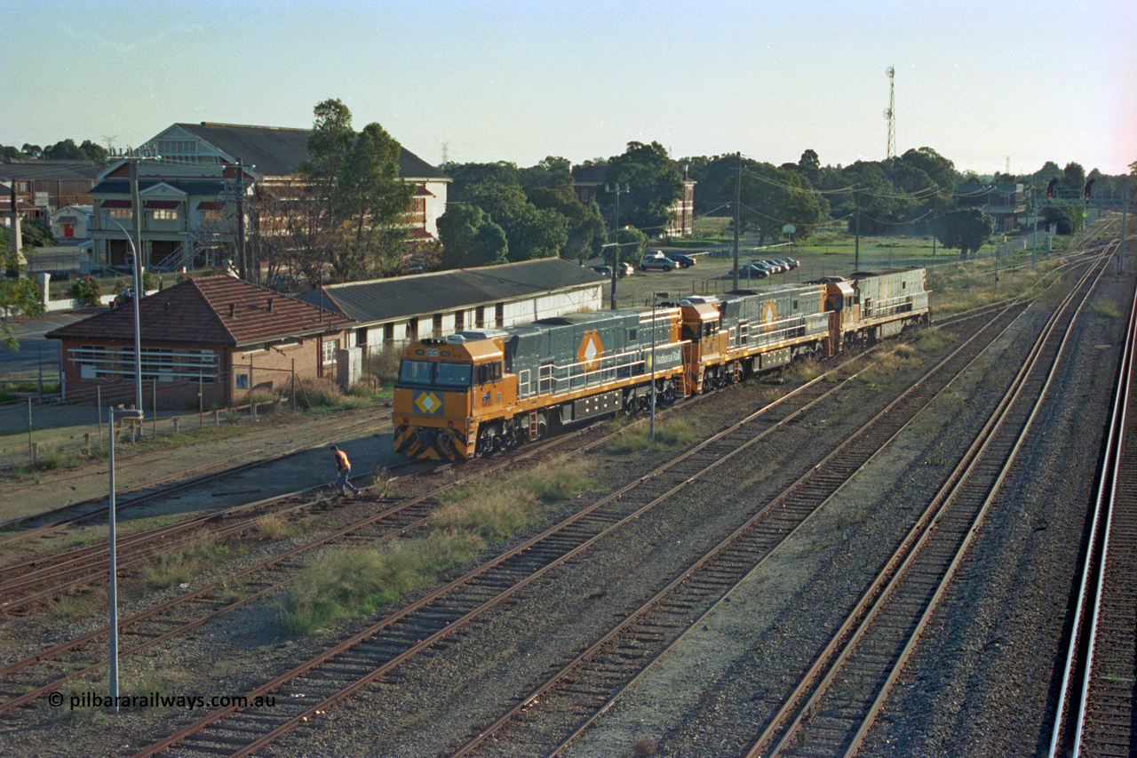 201-17
Midland, two brand Goninan WA built GE Cv40-9i model NR class units NR 102 serial 7250-07/97-302 and NR 101 serial 7250-07/97-303 lead the original Perth built NR 61 serial 7250-11/96-263 as the shunt around the yard.
Keywords: NR-class;NR102;Goninan;GE;CV40-9i;7250-07/97-302;