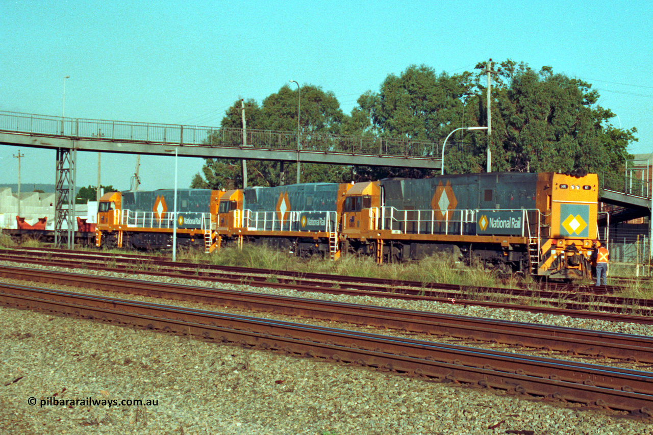 201-25
Midland, the first Perth built NR class NR 61 Goninan GE model Cv40-9i serial 7250-11/96-263 shunts at Midland with two brand new NR units NR 101 and NR 102 with waggon RQRX 60177.
Keywords: NR-class;NR61;Goninan;GE;CV40-9i;7250-11/96-263;