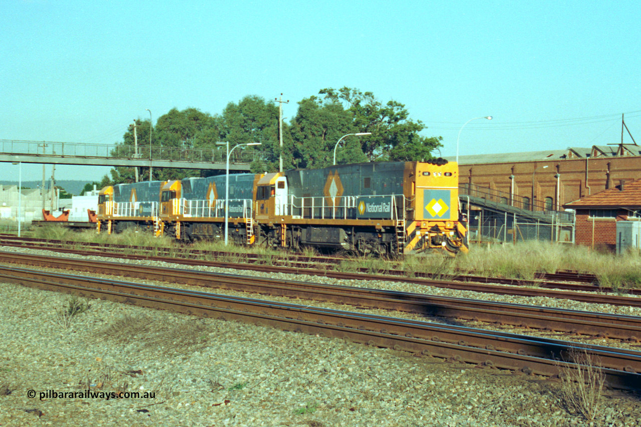 201-27
Midland, the first Perth built NR class NR 61 Goninan GE model Cv40-9i serial 7250-11/96-263 shunts at Midland with two brand new NR units NR 101 and NR 102 with waggon RQRX 60177.
Keywords: NR-class;NR61;Goninan;GE;CV40-9i;7250-11/96-263;