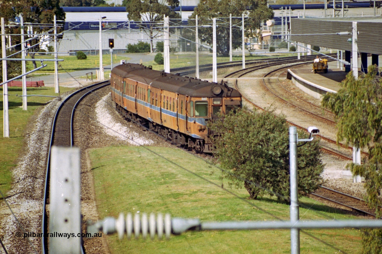 208-2-11
East Perth Passenger Terminal, diesel power narrow gauge commuter set operating under electric wiring.
