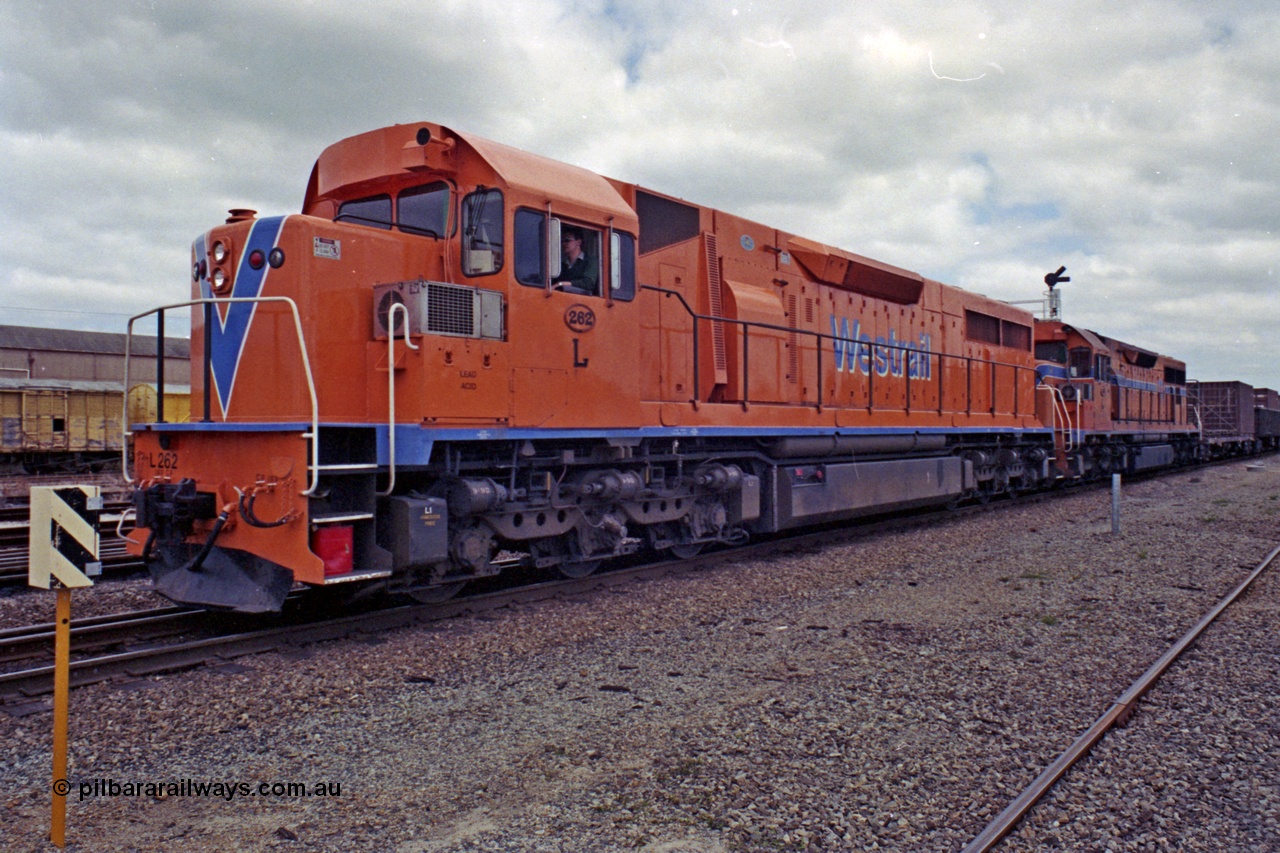 208-2-17
Midland, Westrail L class L 262 Clyde Engineering EMD model GT26C serial 68-552, leading another L class unit on the midday east bound freighter as they prepare to depart, 27th September 1991.
Keywords: L-class;L262;Clyde-Engineering-Granville-NSW;EMD;GT26C;68-552;