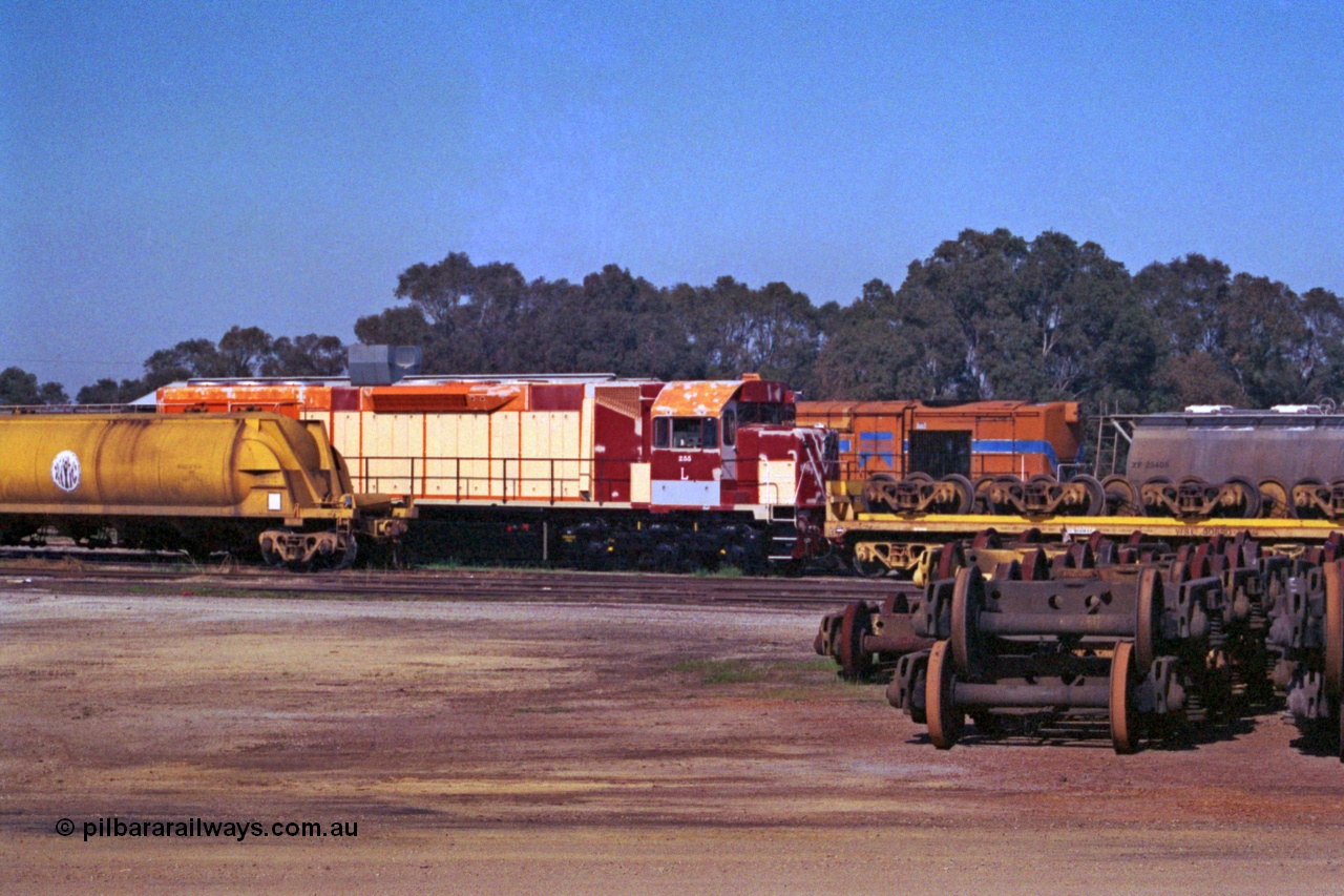 208-2-28
Midland Workshops, Westrail L class L 255 a Clyde Engineering EMD model GT26C, serial 67-545 under overhaul surrounded by various rollingstock including the WSL 30650 bogie transport waggon which was built for this task in 1977 at Midland Workshops.
Keywords: L-class;L255;Clyde-Engineering-Granville-NSW;EMD;GT26C;67-545;WSL-type;WSL30650;
