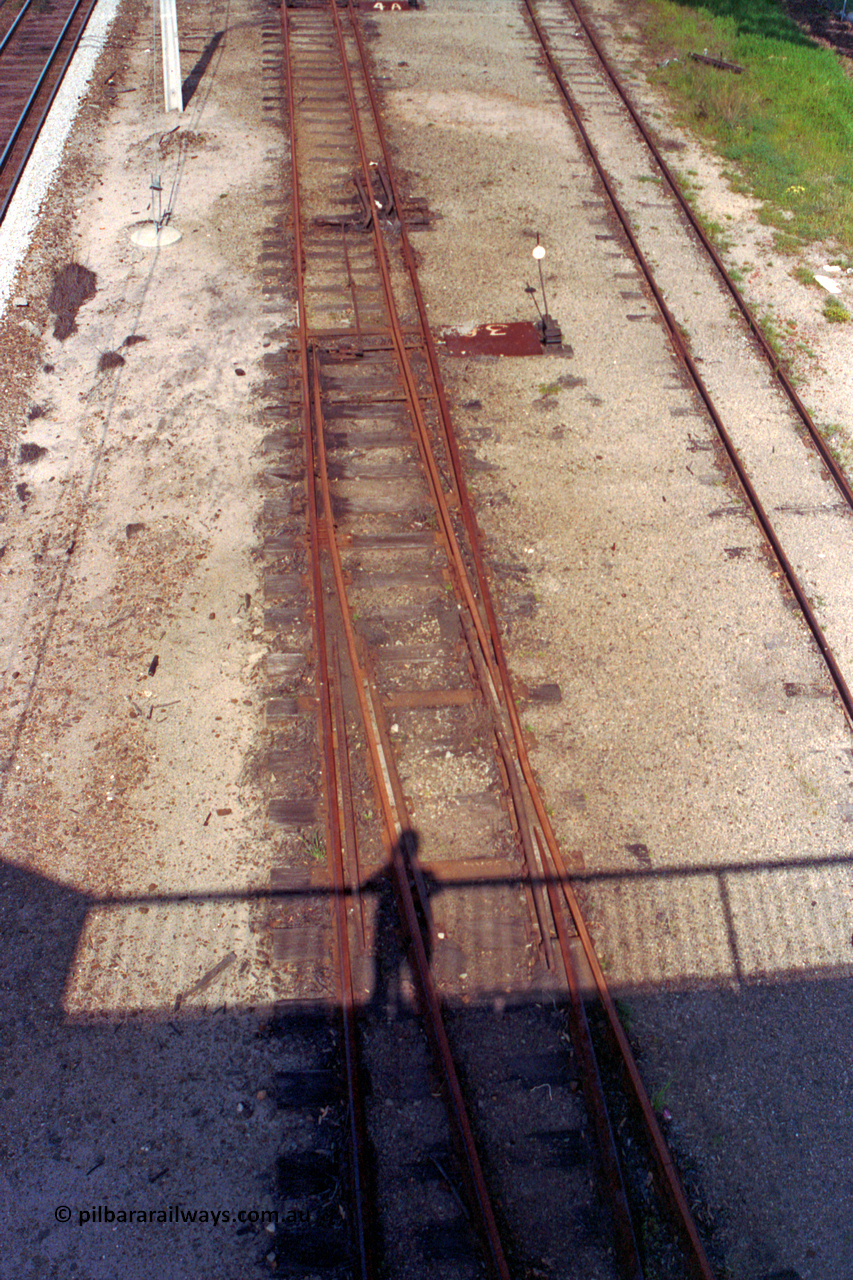 209-12
Ashfield, looking towards Perth from the station overbridge, the dual gauge tracks and yard running between the mainline and Railway Parade on the right. The narrow gauge points are at the foot of the picture.

