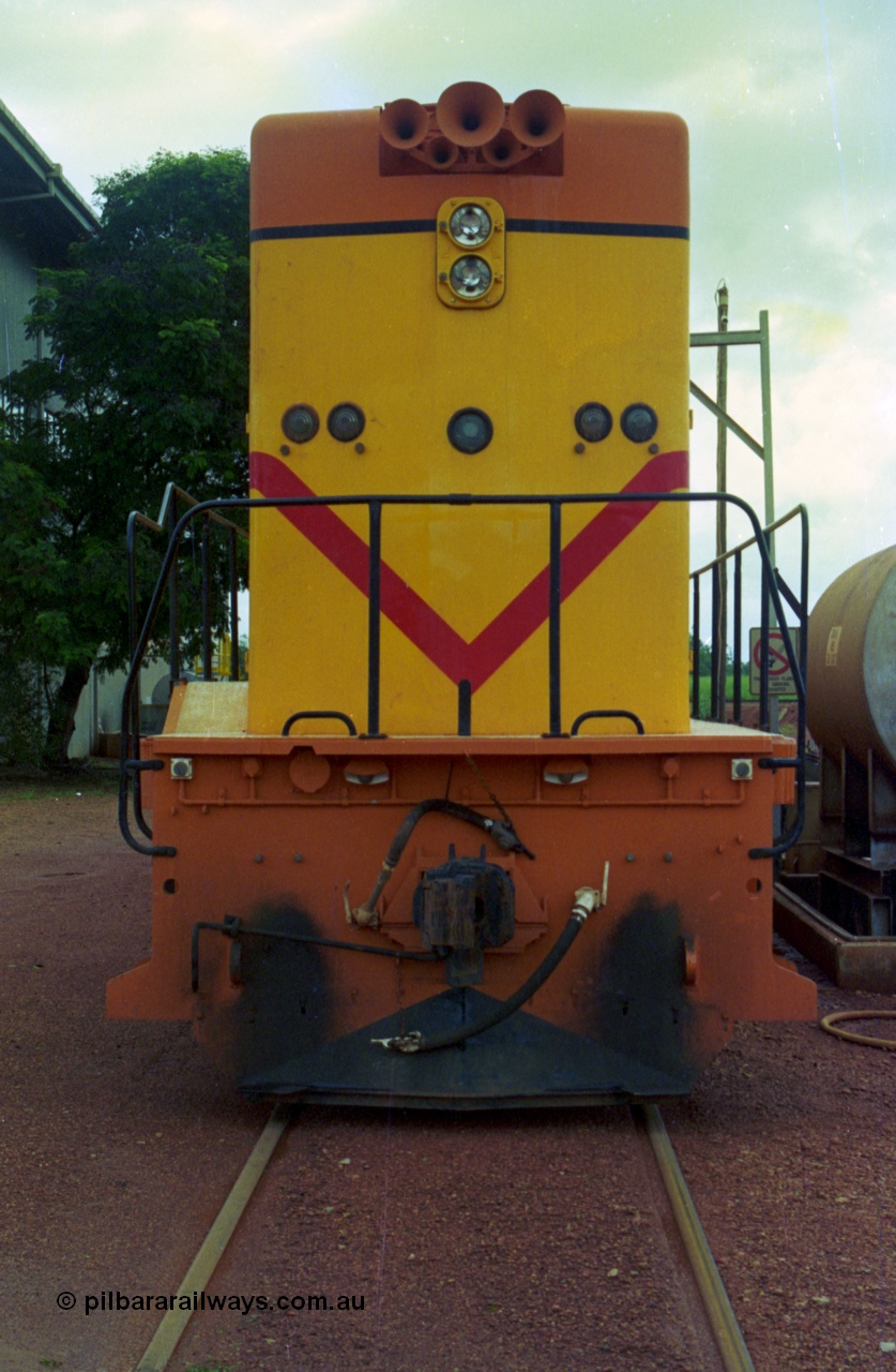 210-11
Weipa, Lorim Point railway workshops, back view of Comalco R 1001 loco Clyde Engineering EMD model GT26C serial 72-752 while is sits at the fuel point, items of note are the five chime horn cut into the hood and as the Weipa locomotives don't work in MU there is only the train brake hose and the main res hose for charging the belly dump discharge doors.
Keywords: R1001;Clyde-Engineering;EMD;GT26C;72-752;1.001;Comalco;