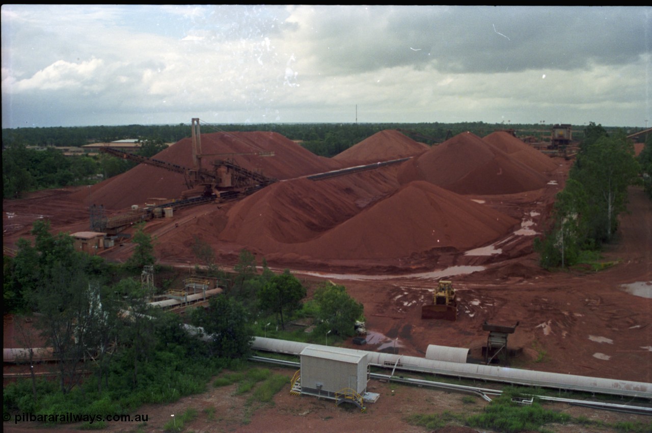211-02
Weipa, Lorim Point, view from kaolin storage silos looking at the shiploading stockpile area of bauxite.

