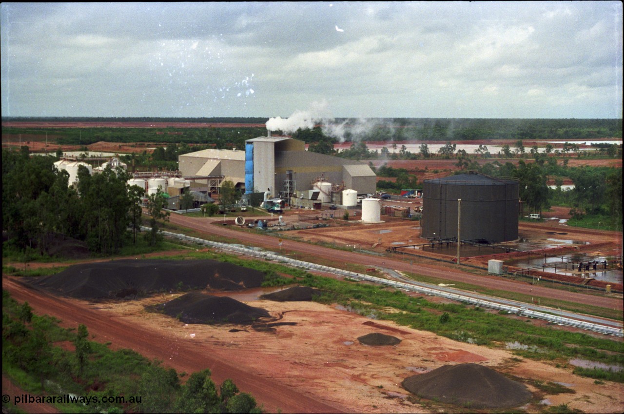 211-05
Weipa, Lorim Point, overview of the short lived Comalco Kaolin plant from the storage silos. The bauxite calcification plant is left of image.
Keywords: Comalco-Kaolin;