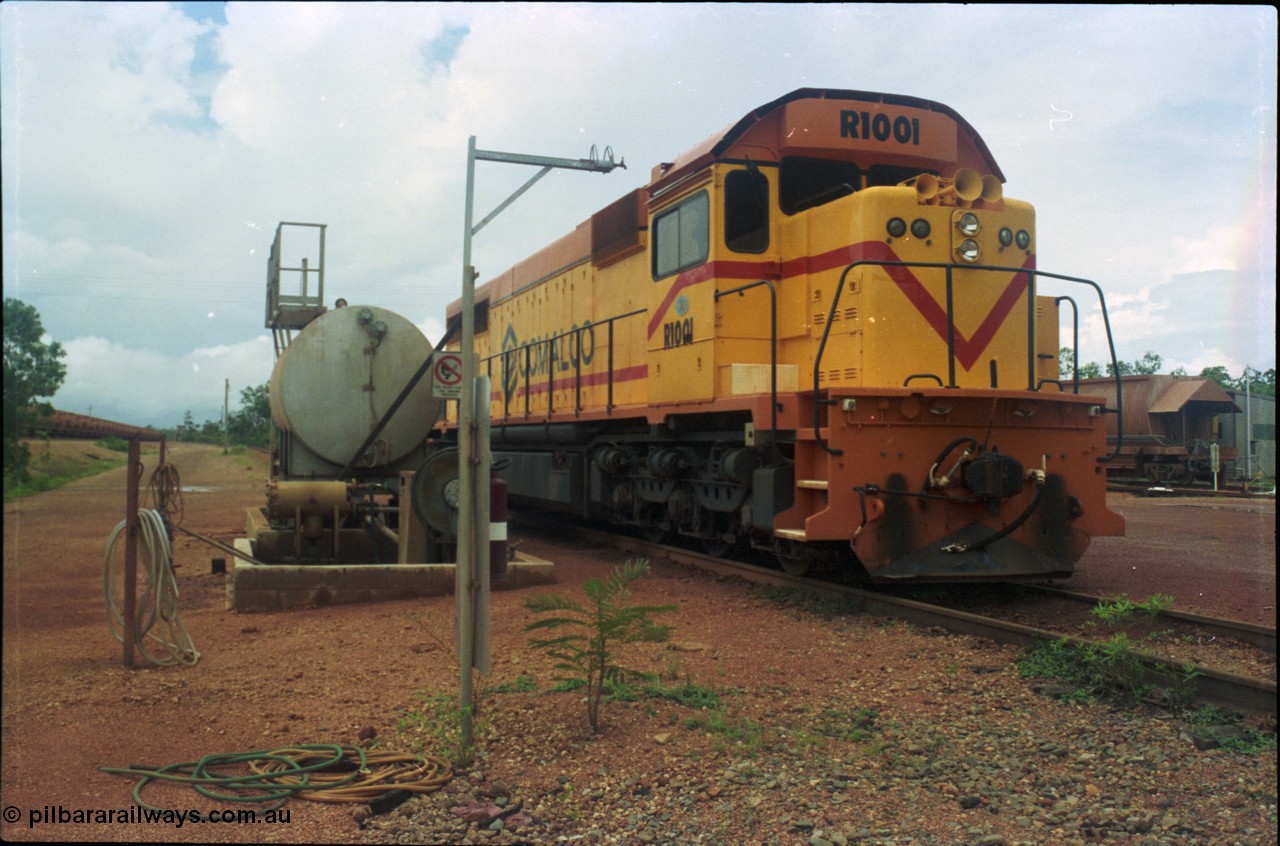 211-25
Weipa, Lorim Point railway workshops, 3/4 LHS or driver's side view of Comalco R 1001 loco Clyde Engineering EMD model GT26C serial 72-752 while is sits at the fuel point, items of note are the second 'tropical roof' and the five chime horn cut into the nose. Also noticeable, the units don't have dynamic brakes fitted so there is no brake 'blister' in the middle of the hood like the WAGR L or VR C classes which are also GT26C models.
Keywords: R1001;Clyde-Engineering;EMD;GT26C;72-752;1.001;Comalco;