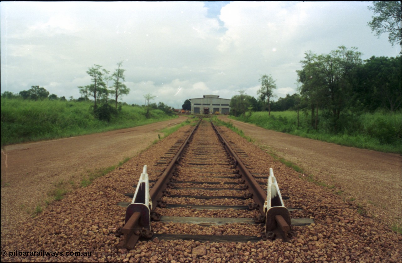 211-28
Weipa, Lorim Point railway workshops, view of the end of the line looking east, workshops in the distance.
