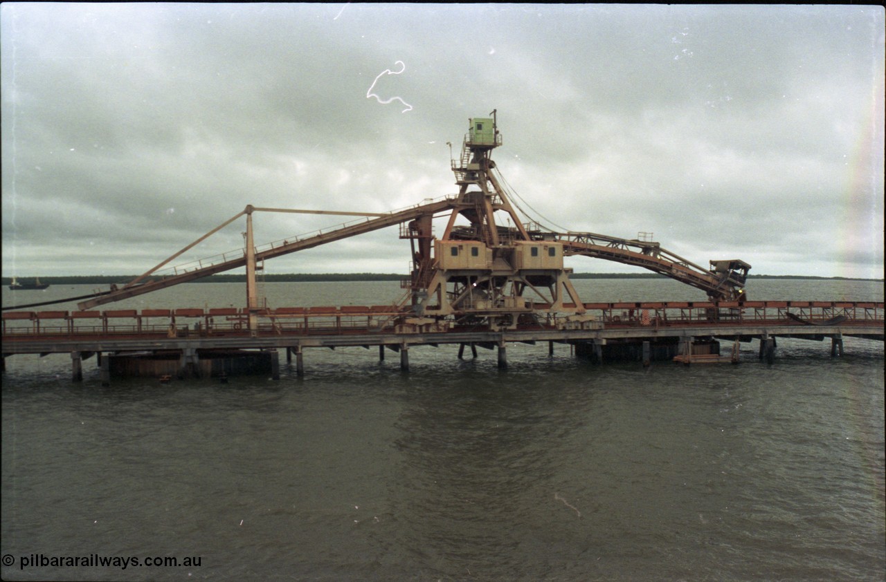 211-29
Weipa, Lorim Point, side view of no. 1 bauxite ship loader in the cyclone tie-down position.
