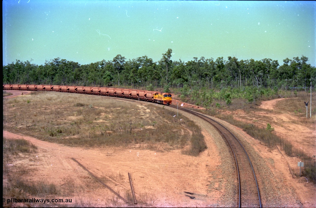 212-10
Weipa, a loaded train from Andoom Mine rounds the curve on approach to Lorim Point behind Comalco R 1004 Clyde Engineering EMD JT26C serial 90-1277 which is former Goldsworthy Mining loco GML 10.
Keywords: R1004;Clyde-Engineering-Kelso-NSW;EMD;JT26C;90-1277;Comalco;GML10;Cinderella;GML-class;