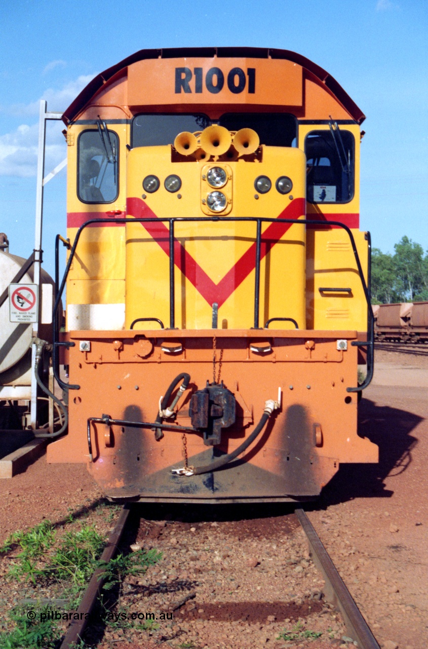 213-13
Weipa, Lorim Point workshops looking east, Comalco R 1001 loco Clyde Engineering built EMD model GT26C serial 72-752 sits at the fuel point, items of note are these units were setup to have the long hood leading, the second 'tropical roof' and the five chime horn cut into the nose. This unit is almost identical to the GT26C models of the WAGR L class. September 1995.
Keywords: R1001;Clyde-Engineering;EMD;GT26C;72-752;1.001;Comalco;