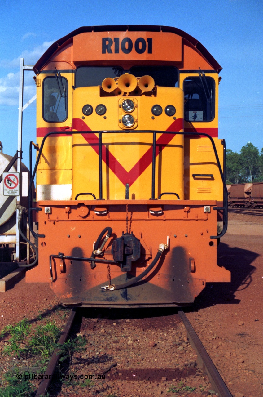 213-14
Weipa, Lorim Point workshops looking east, Comalco R 1001 loco Clyde Engineering built EMD model GT26C serial 72-752 sits at the fuel point, items of note are these units were setup to have the long hood leading, the second 'tropical roof' and the five chime horn cut into the nose. This unit is almost identical to the GT26C models of the WAGR L class. September 1995.
Keywords: R1001;Clyde-Engineering;EMD;GT26C;72-752;1.001;Comalco;