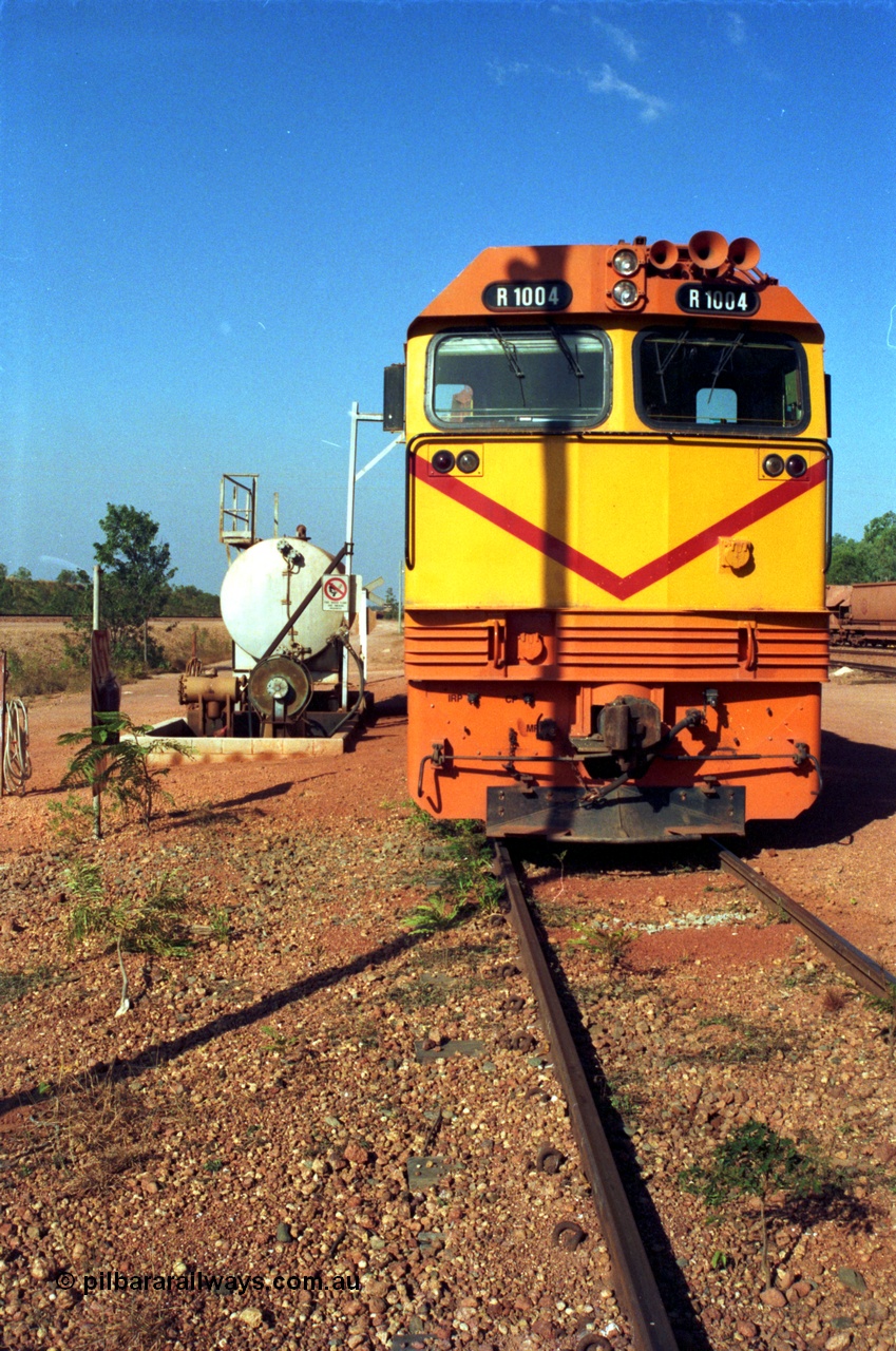 213-21
Weipa, Lorim Point fuel point, Comalco R 1004 loco Clyde Engineering built EMD model JT42C built 1990 serial 90-1277, weight 132 tonne, engine 12-710G3A, generator AR11-WBA-CA5, traction motors D87ETR, rated power 2460 kW/3300 hp. The body is similar to a V/Line N class while the components are the same as the Australian National AN class. Originally built for Goldsworthy Mining as GML 10 for use at their Western Australian iron ore railway and locally known as Cinderella. Purchased by Comalco in 1994 following the takeover of Goldsworthy by BHP.
Keywords: R1004;Clyde-Engineering-Kelso-NSW;EMD;JT26C;90-1277;Comalco;GML10;Cinderella;GML-class;