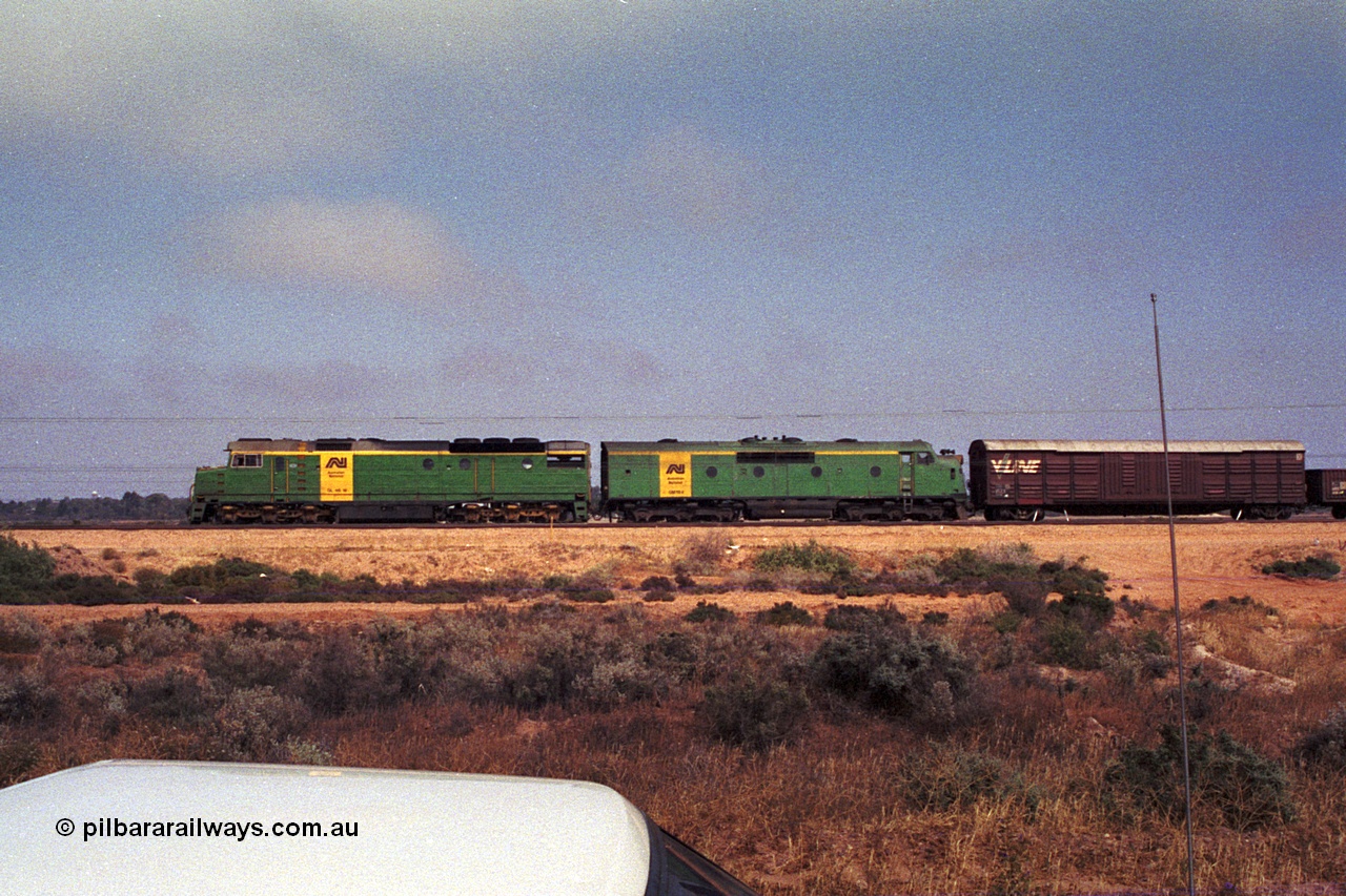 215-04
Port Augusta, side view of AN livered DL class DL 46 Clyde Engineering EMD model AT42C serial 88-1254 and GM class GM 18 Clyde Engineering EMD model A16C serial 57-139.
Keywords: DL-class;DL46;Clyde-Engineering-Kelso-NSW;EMD;AT42C;88-1254;