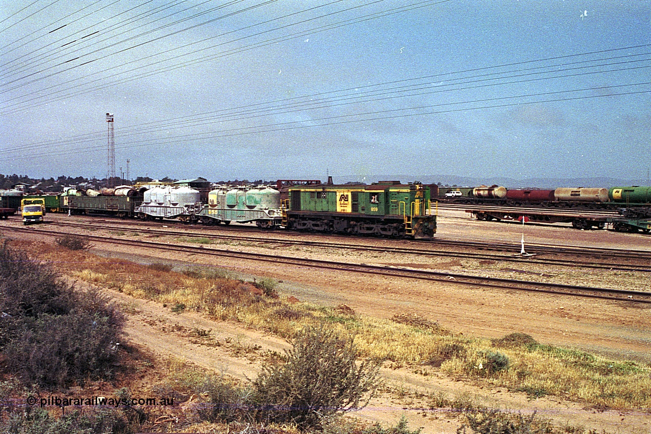 215-05
Port Augusta, AN liveried 830 class locomotive 859 AE Goodwin ALCo model DL531 serial 84705 performs shunting duties in the yard.
Keywords: 830-class;859;AE-Goodwin;ALCo;DL531;84705;