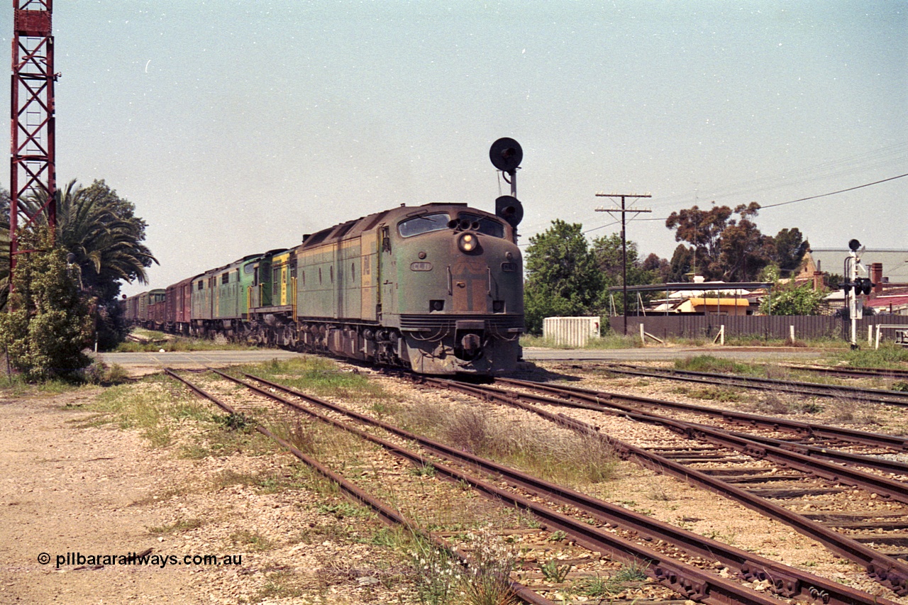 215-11
Peterborough, an SP Perth bound service crosses Sliver Street behind the AN liveried quad combination of Clyde Engineering EMD model AT26C CL class Bulldog CL 11 serial 71-739 which in later life became CLF 2, ALCo model DL541 600 class 605 serial G6015/04 which went on to become , and EMD model A16C GM class Bulldog units GM 43 serial 67-529 and GM 46 serial 67-532.
Keywords: CL-class;600-class;GM-class;CL11;605;GM43;GM46;bulldog;AT26C;DL541;71-739;G6015-4;AE-Goodwin;ALCo;EMD;Clyde-Engineering-Granville-NSW;A16C;67-529;67-532;