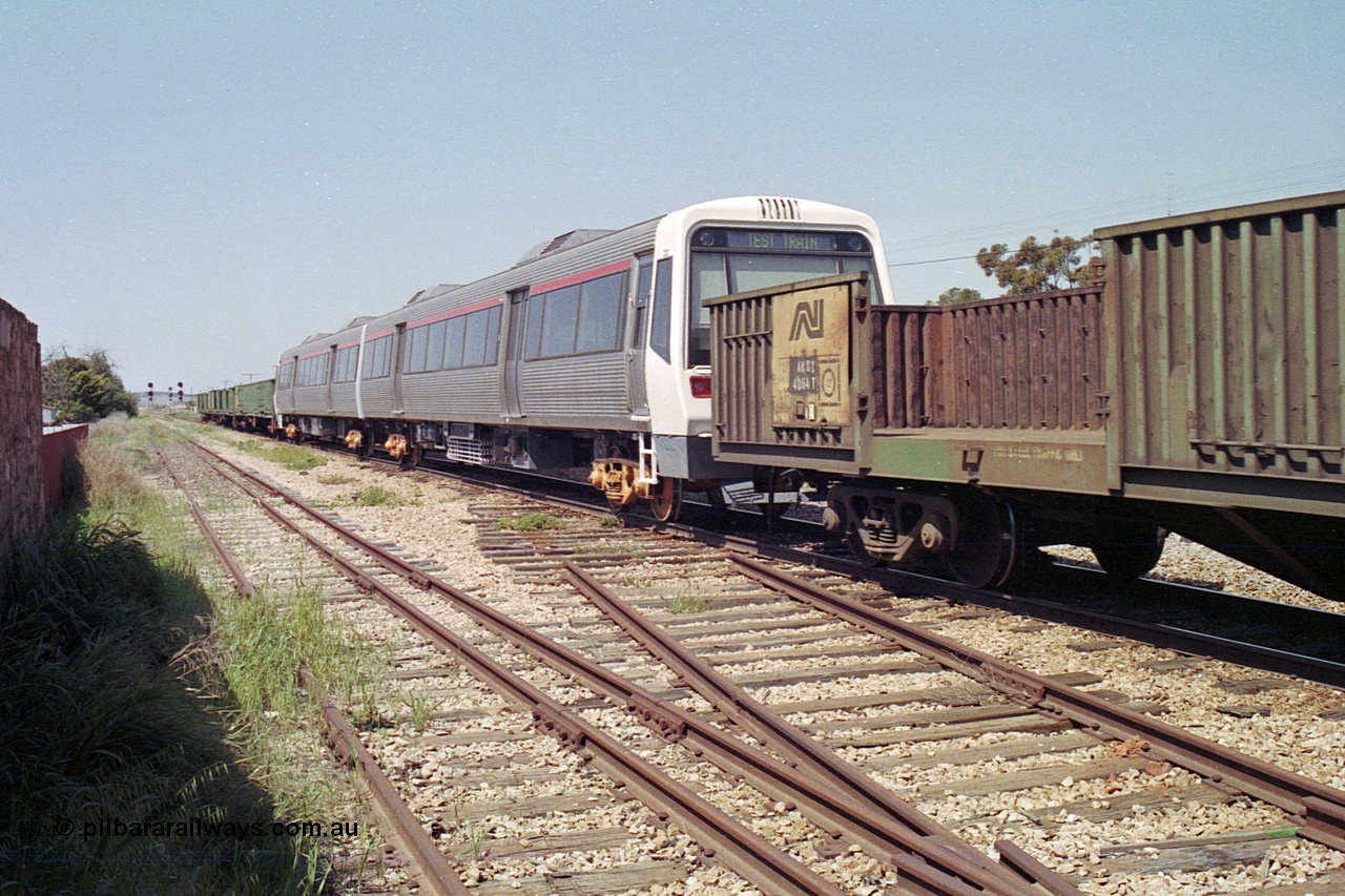 215-13
Peterborough, a new Perth electric suburban A Set being transported across the country on the rear of an SP service, AEA class AEA 220 and an AEB, built by Walkers Limited in Maryborough, Qld. The narrow gauge power bogies are in the following open waggon.
Keywords: A-class;AEA220;Walkers-Ltd-Qld;