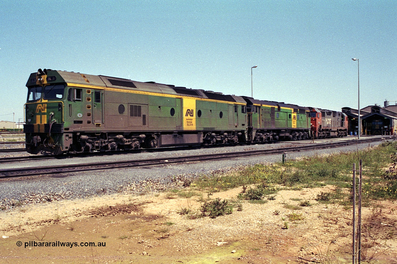 215-20
Dry Creek Motive Power Centre, fuel point roads, AN BL class BL 31 Clyde Engineering EMD model JT26C-2SS serial 83-1015 with 700 class 704 AE Goodwin ALCo model DL500G serial G6059-2 rest between jobs with V/Line broad gauge N class behind them.
Keywords: BL-class;BL31;Clyde-Engineering-Rosewater-SA;EMD;JT26C-2SS;83-1015;