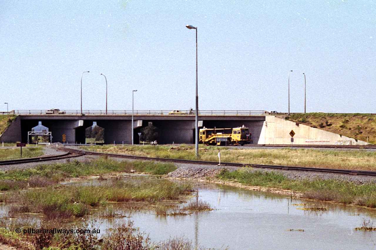 215-24
Dry Creek Motive Power Centre, view looking north as a track tamper arrives into Dry Creek Yard.

